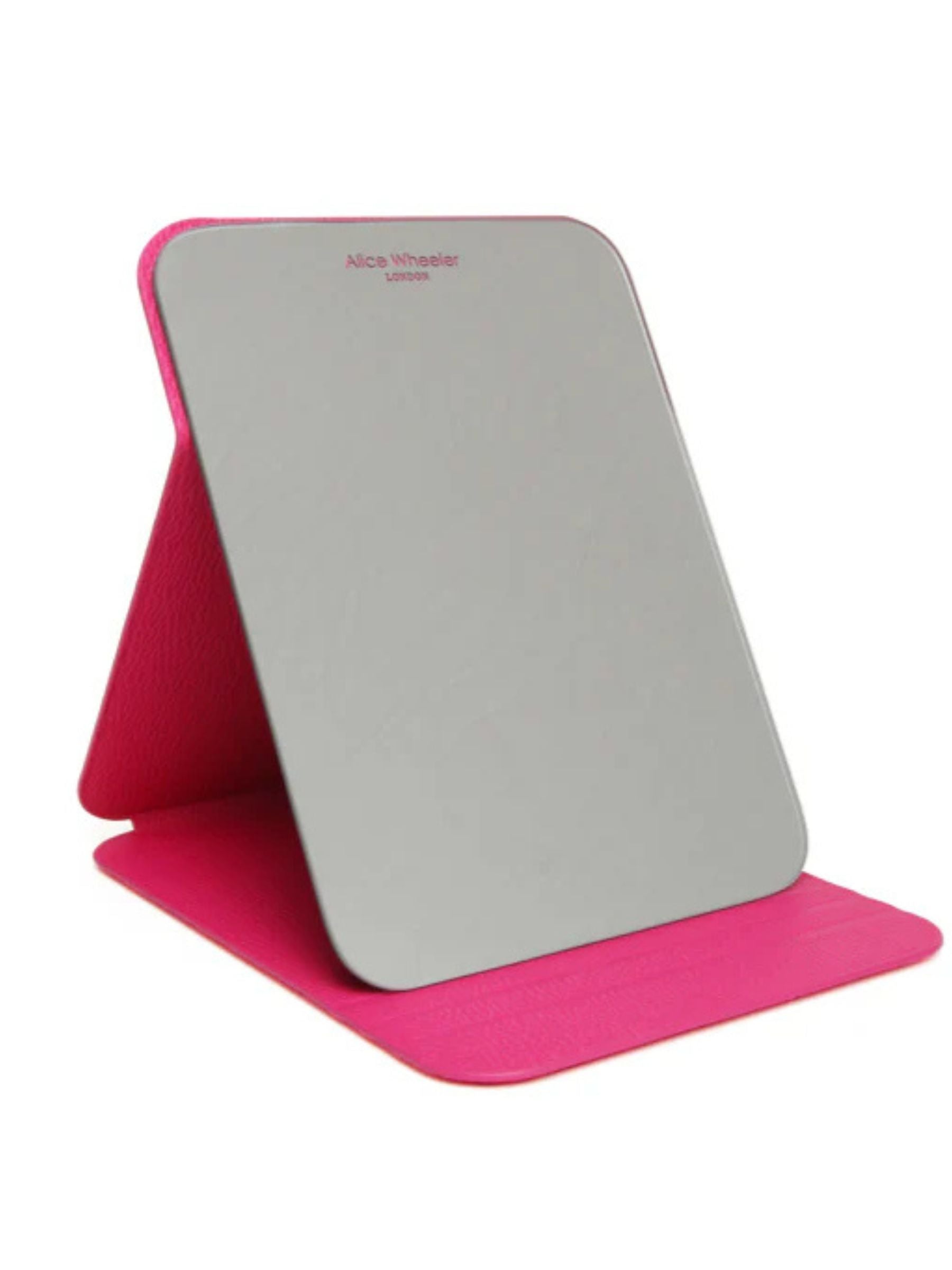 ALICE WHEELER AW0306 hot pink folding travel mirror with frameless design, protective folding case and stand, 15 × 20 cm size.