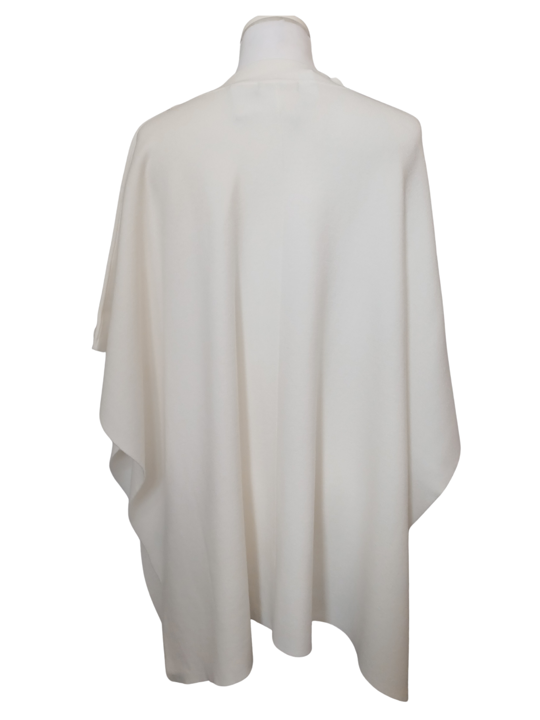 Cape by Alice Collins featuring button detailing on the shoulder, patch pockets and a high neckline – soft lightweight knit ideal for layering and casual everyday wear.