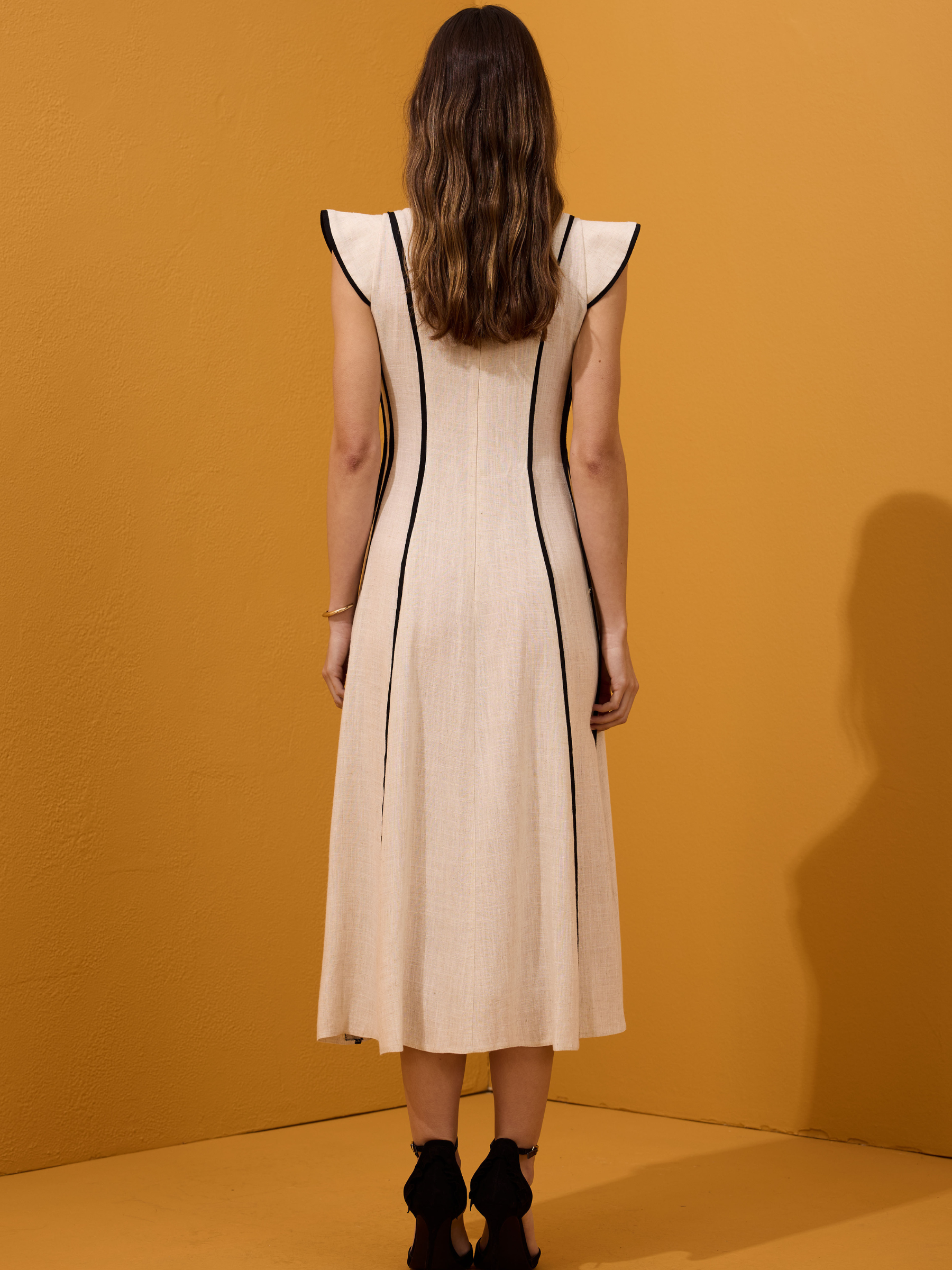 Arggido 49540 midi dress with structured panel detailing, cap sleeves and softly flared skirt.