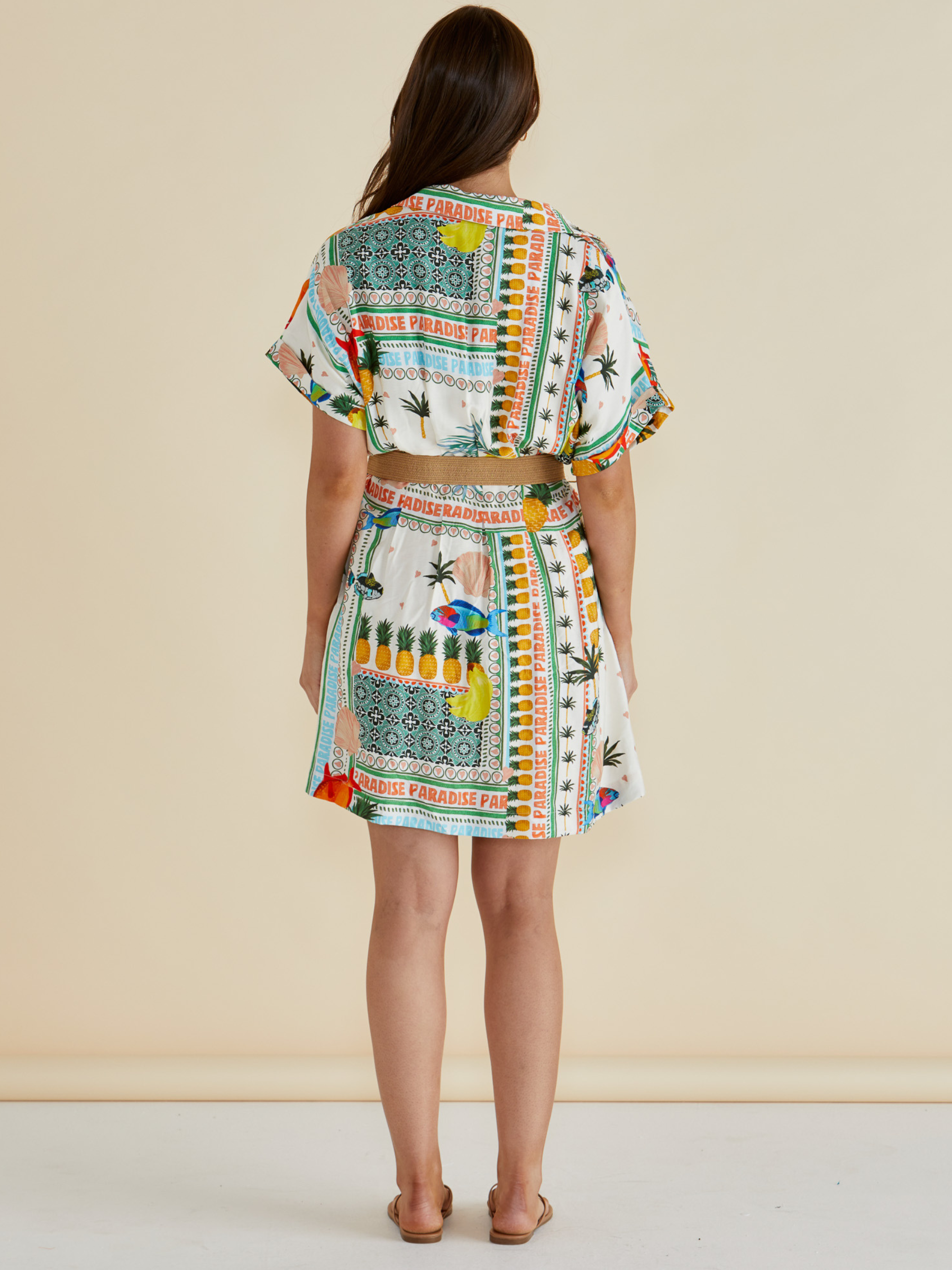 Betty Archer Dress with short sleeves, button-through front, detachable belt and colourful tropical “Paradise” patchwork print.