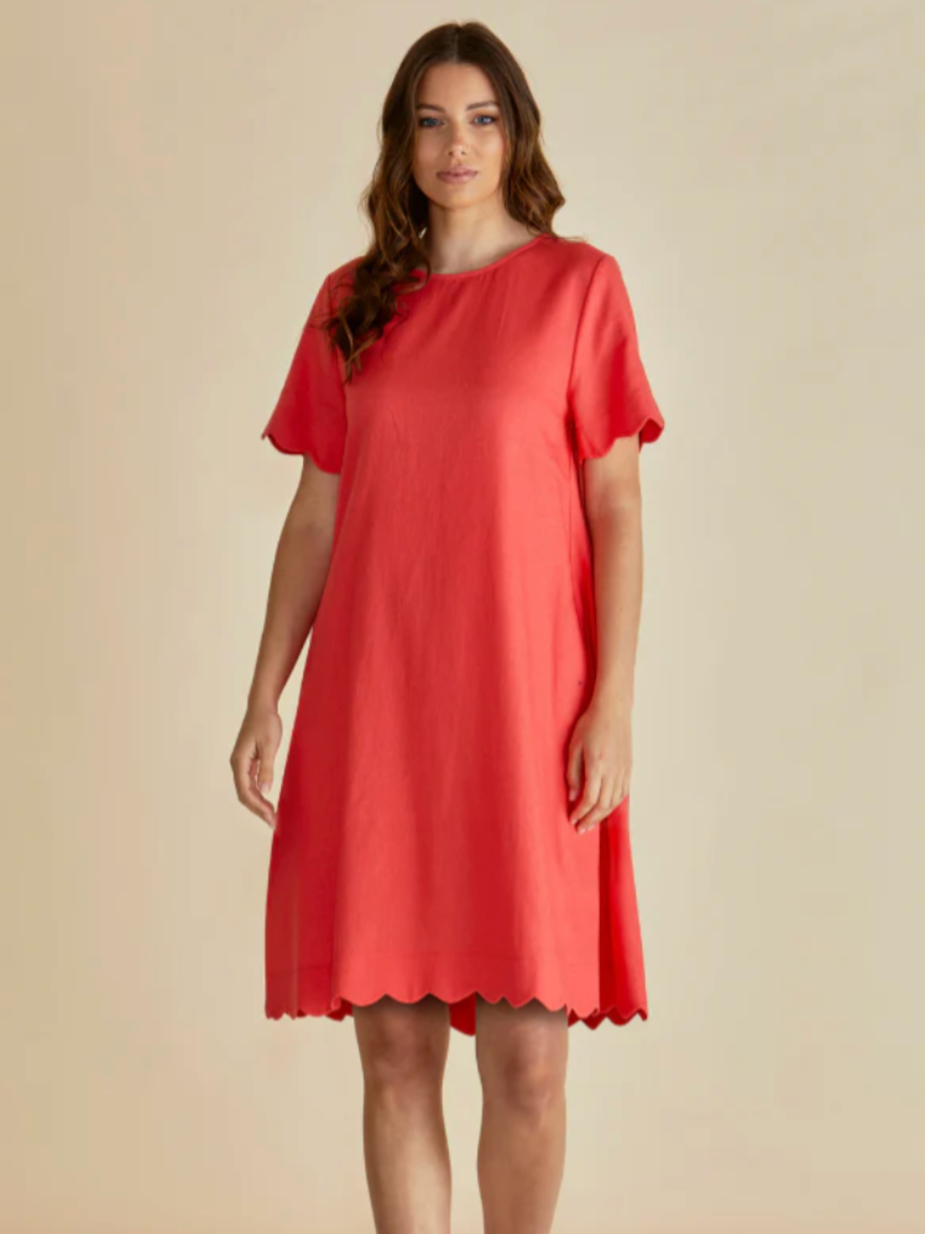 Betty Dawn Shift Dress with round neckline, short sleeves, relaxed shift silhouette and scalloped hem.