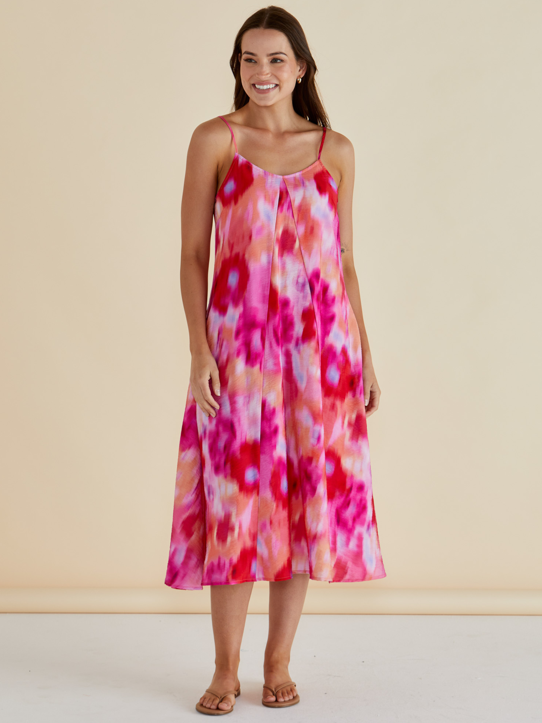 Betty Harriet Dress with draped neckline, adjustable straps and midi-length A-line silhouette.