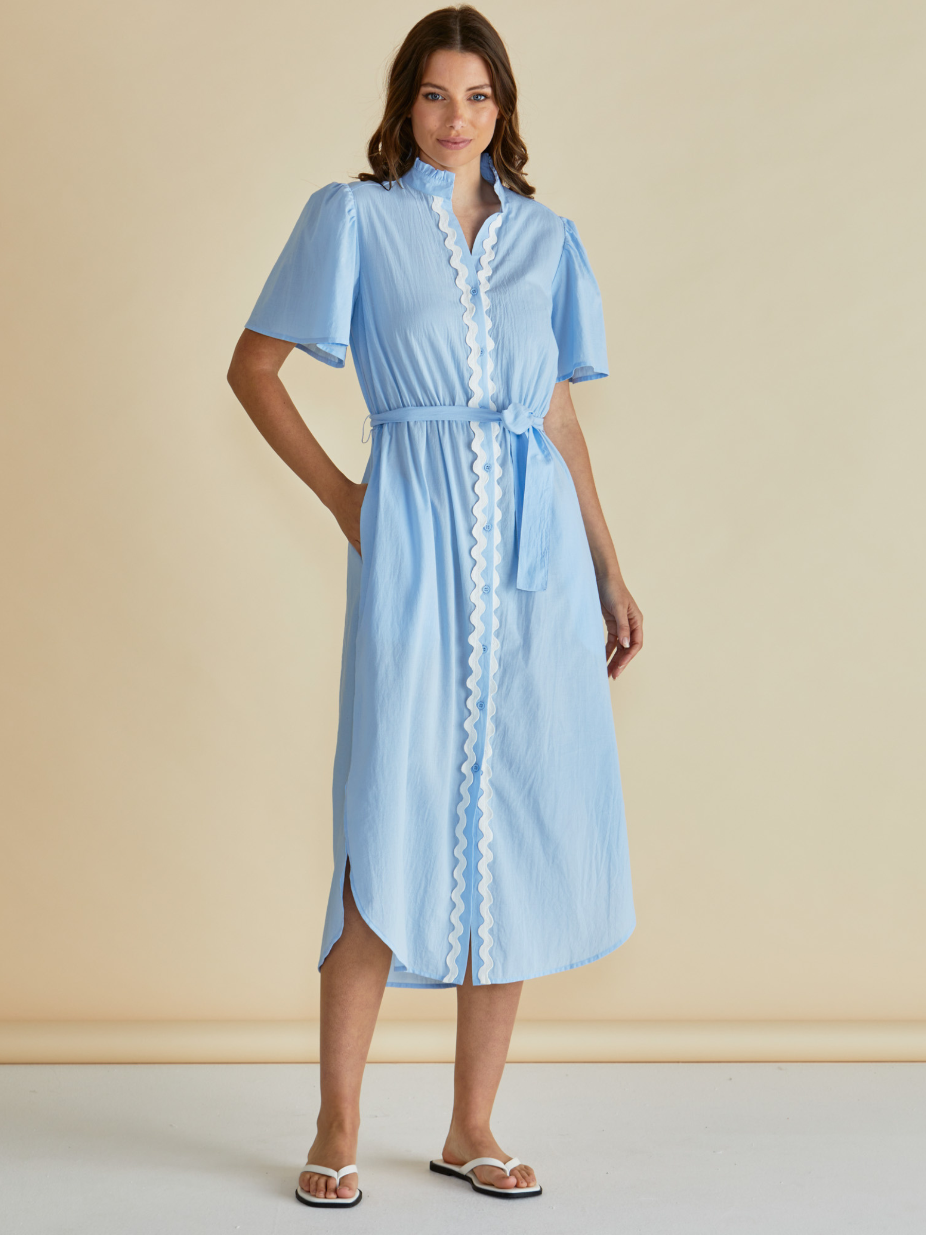 Betty Immie Dress with stand collar, button-through front, flutter sleeves and self-tie waist belt.