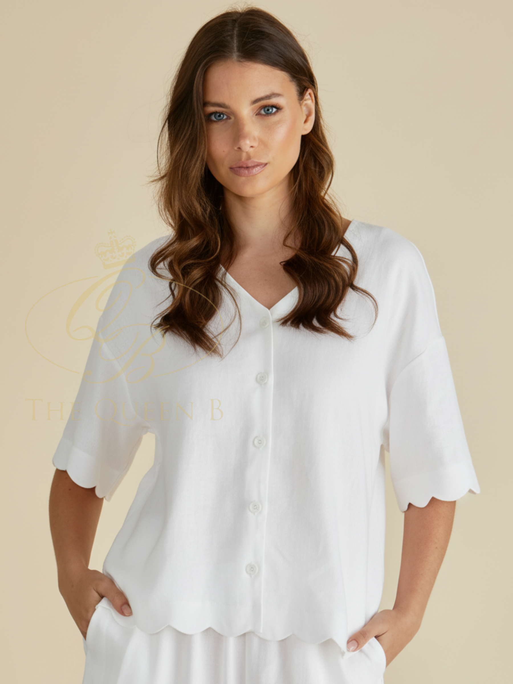 Betty Scarlett Shirt with V neckline, button-through front, short sleeves and scalloped hem.