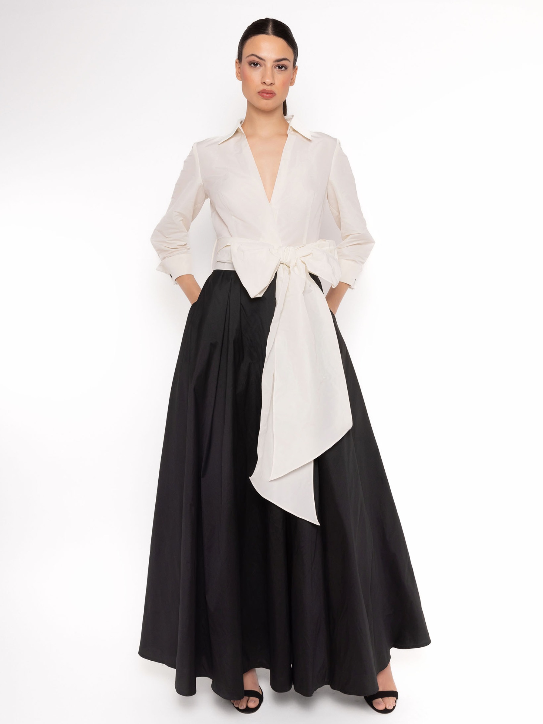 Carla Ruiz 152502 white and black dress with plunging V-neck bodice, tie waist sash and flowing A-line maxi skirt.