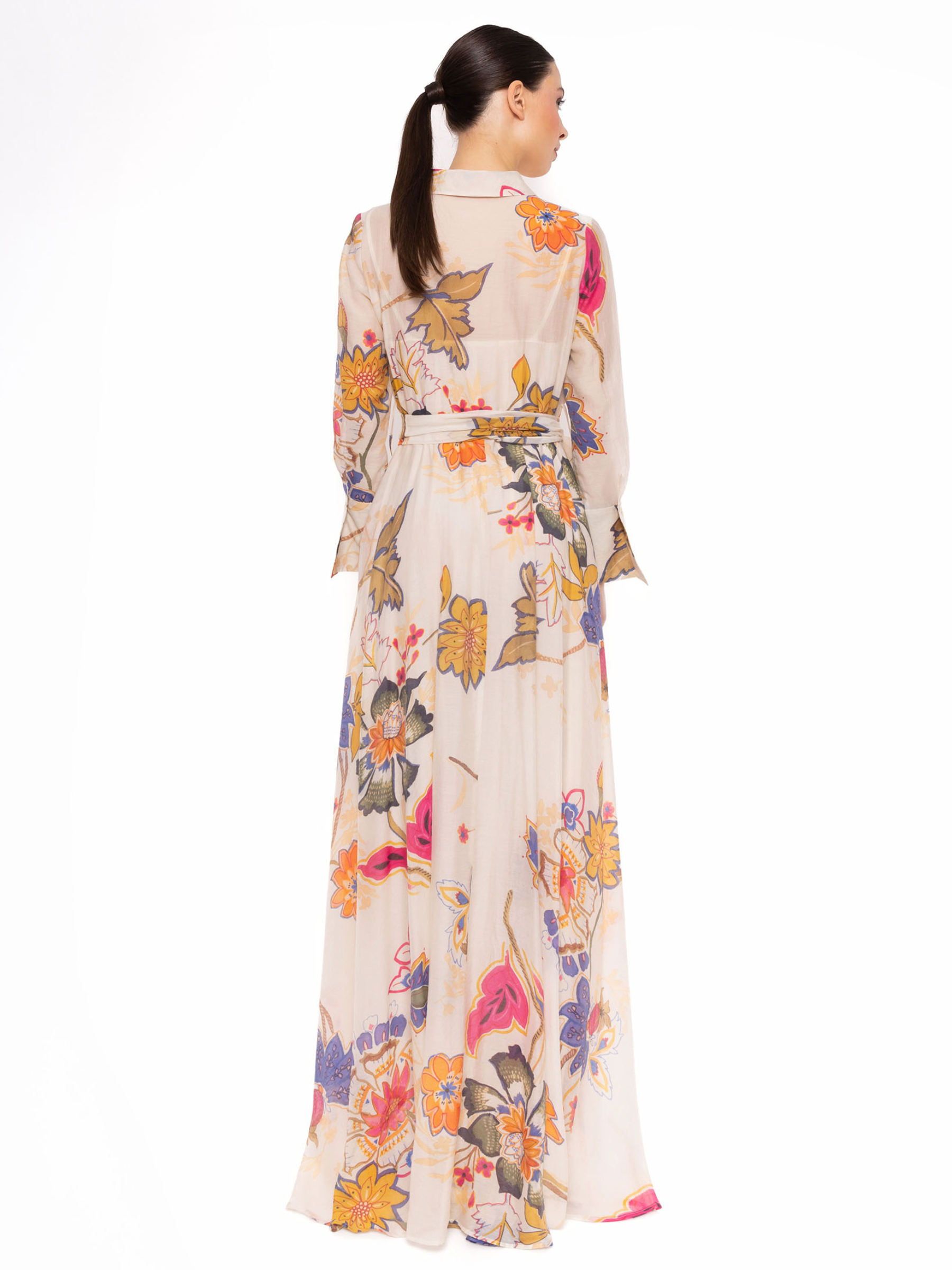 Carla Ruiz 152538 White Dress with botanical print, shirt-style neckline, tie-belt waist and flowing maxi skirt.