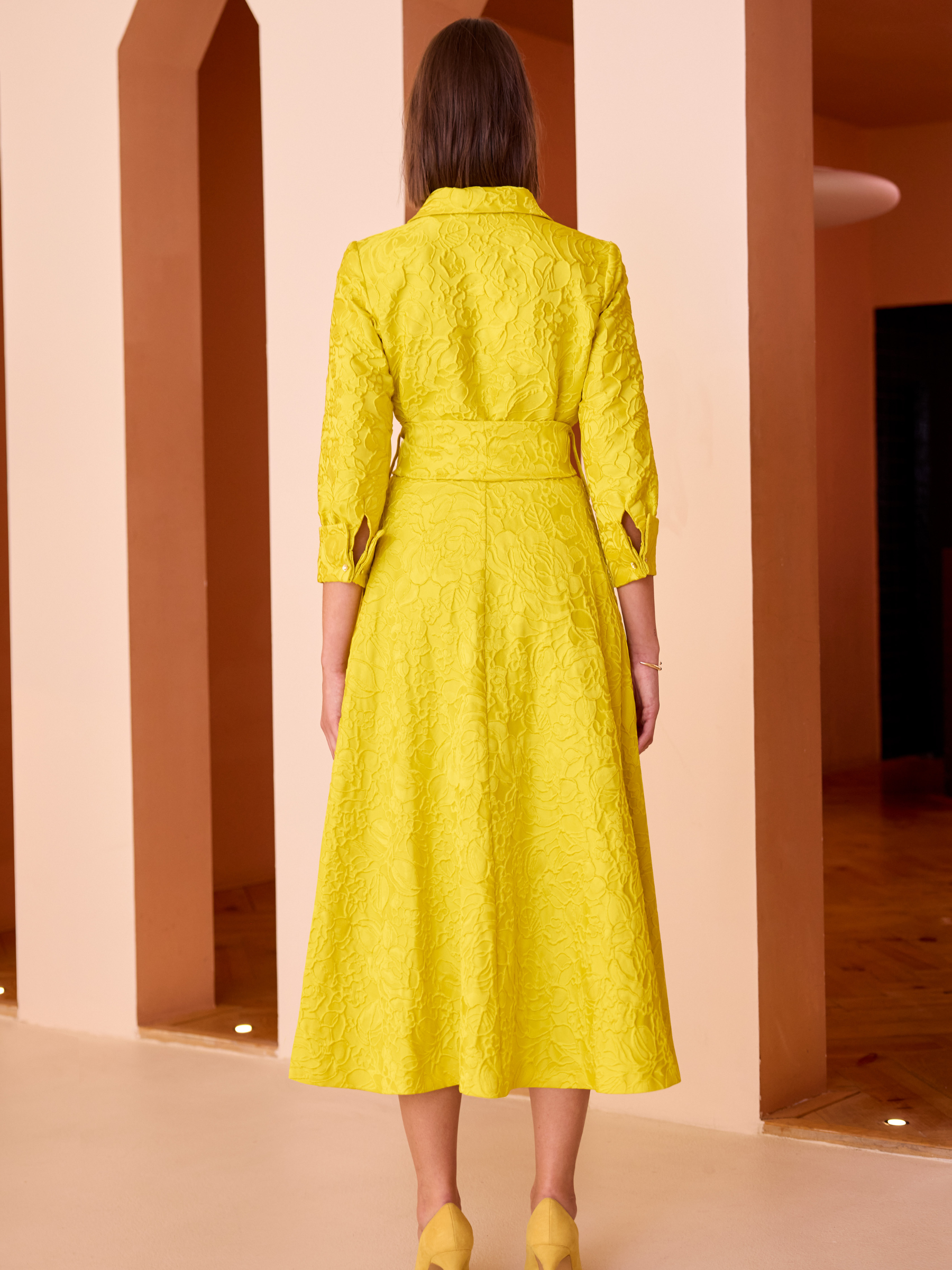 Carla Ruiz 52527 Yellow Dress with textured jacquard fabric, wrap-effect waist tie and A-line midi skirt.