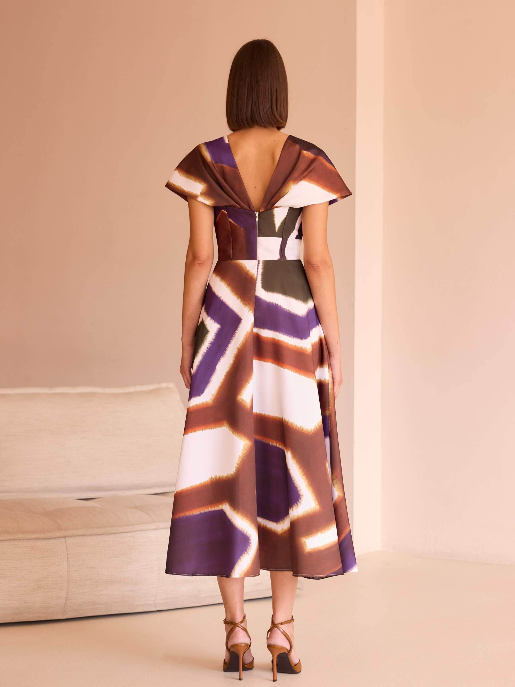 Carla Ruiz 52542 Brown Dress with abstract print, deep V-neckline, cape-effect sleeves and A-line midi skirt.