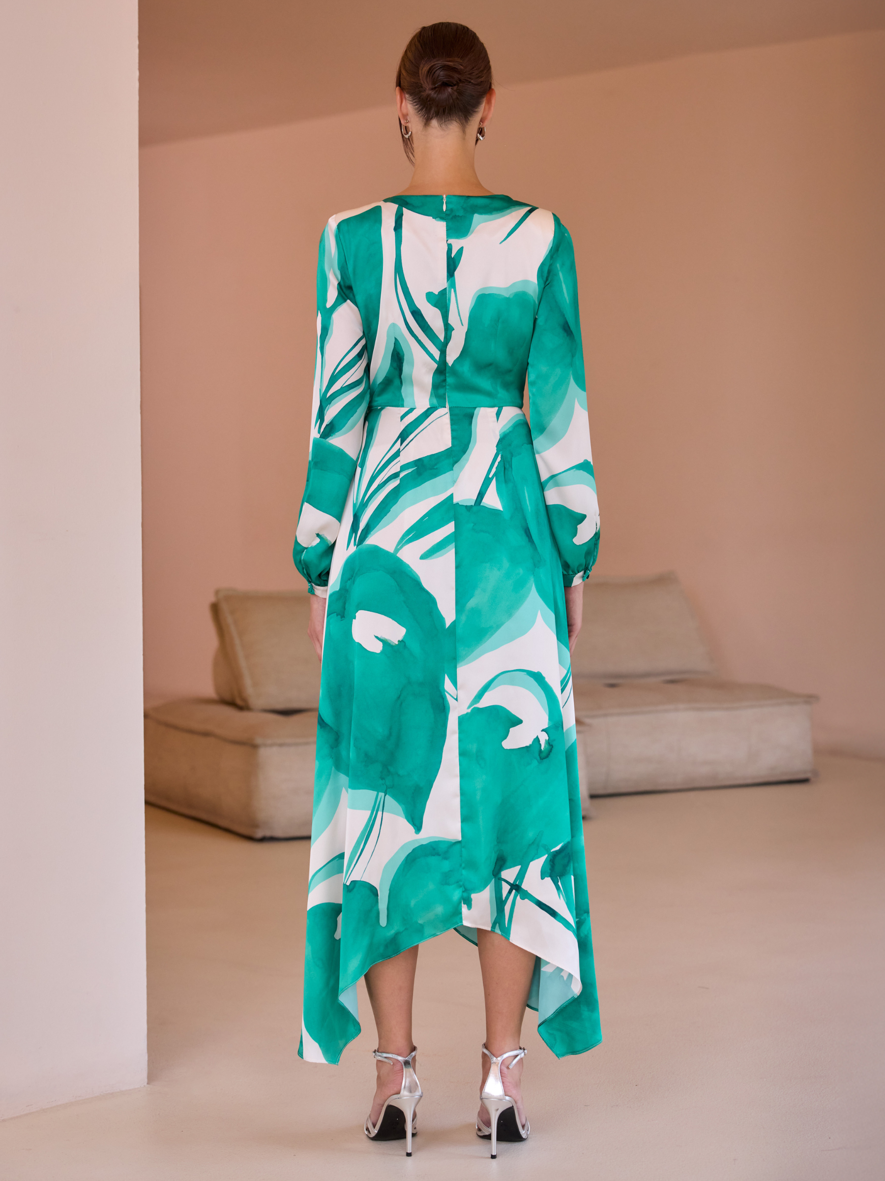 Carla Ruiz 52569 Green Dress with wrap bodice, long sleeves, abstract print and asymmetrical handkerchief-hem A-line skirt.