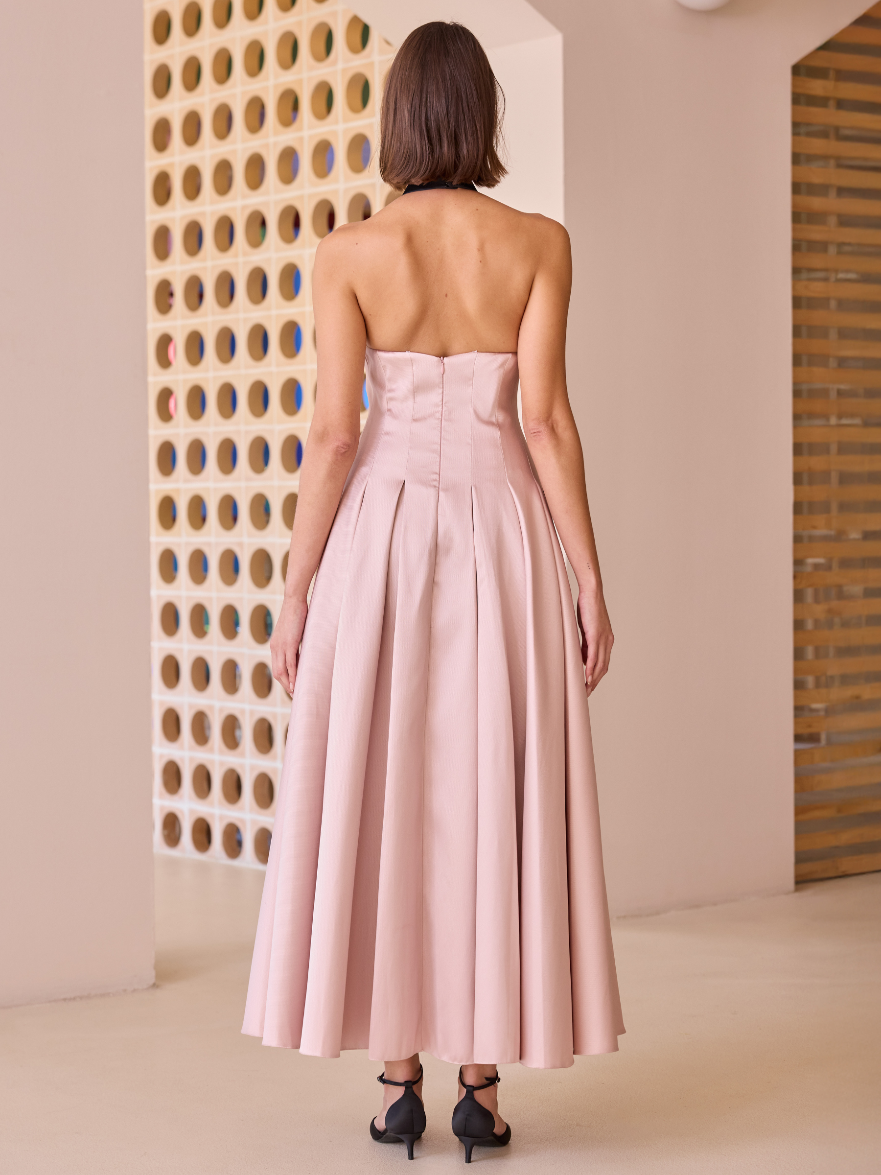 Carla Ruiz 52623 pink halterneck dress with pleated skirt and statement floral waist detail.