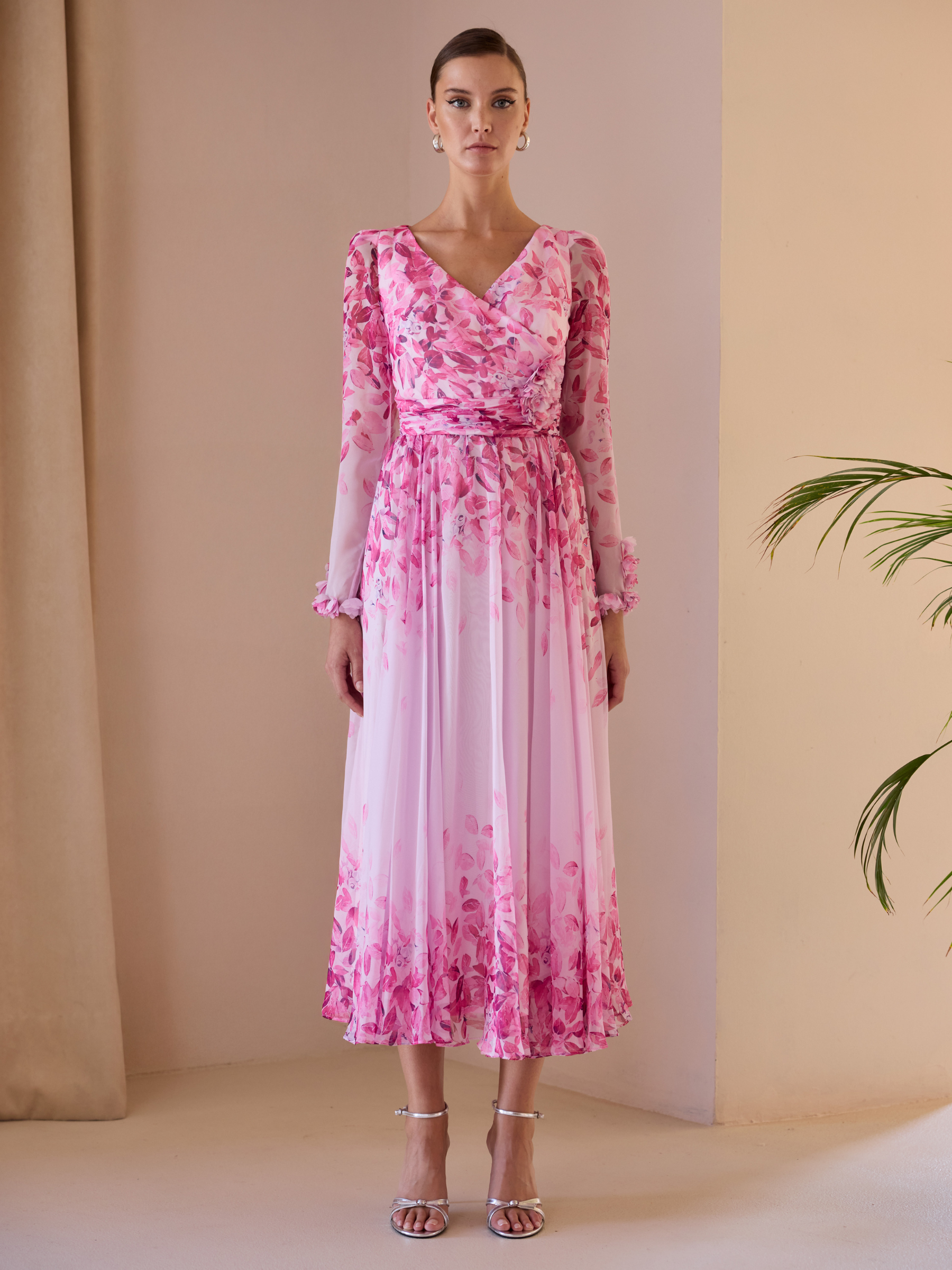 Carla Ruiz 52707 pink A-line dress with V-neckline, draped bodice, sheer long sleeves and flowing skirt.