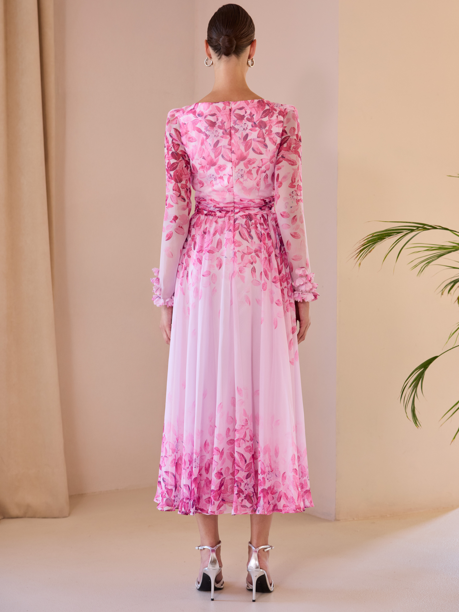 Carla Ruiz 52707 pink A-line dress with V-neckline, draped bodice, sheer long sleeves and flowing skirt.