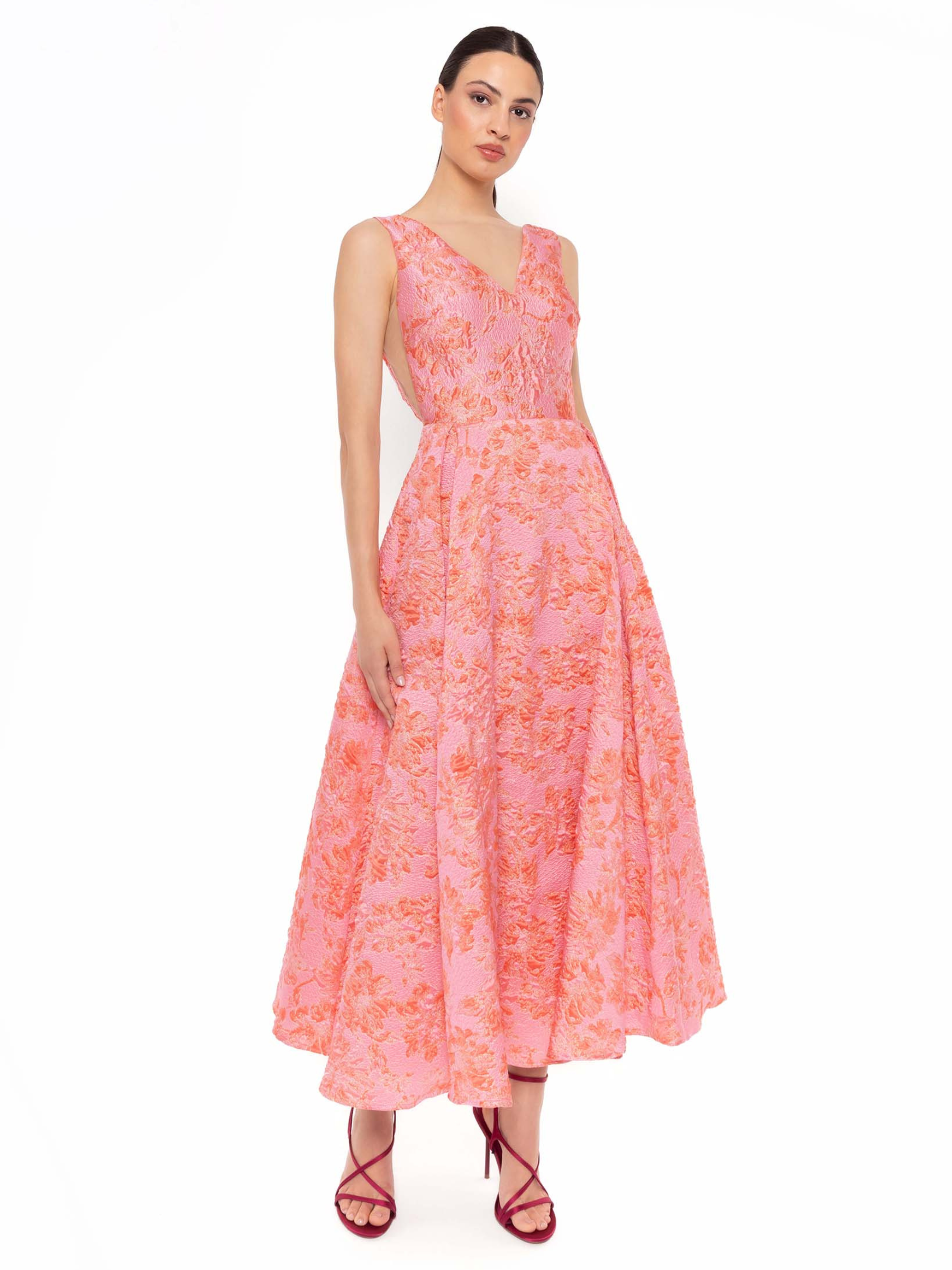 Carla Ruiz 52719 pink dress with floral jacquard detailing, V-neckline and flared skirt.