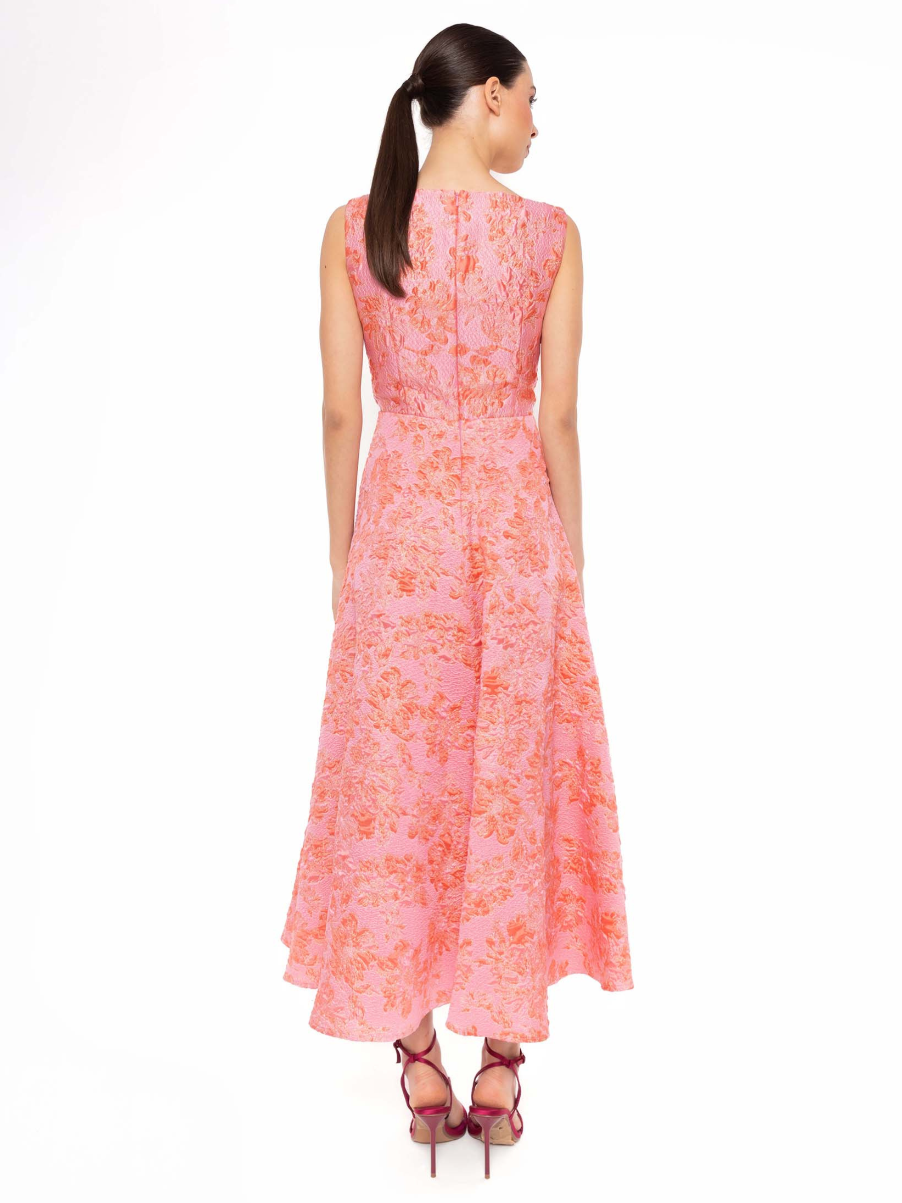 Carla Ruiz 52719 pink dress with floral jacquard detailing, V-neckline and flared skirt.