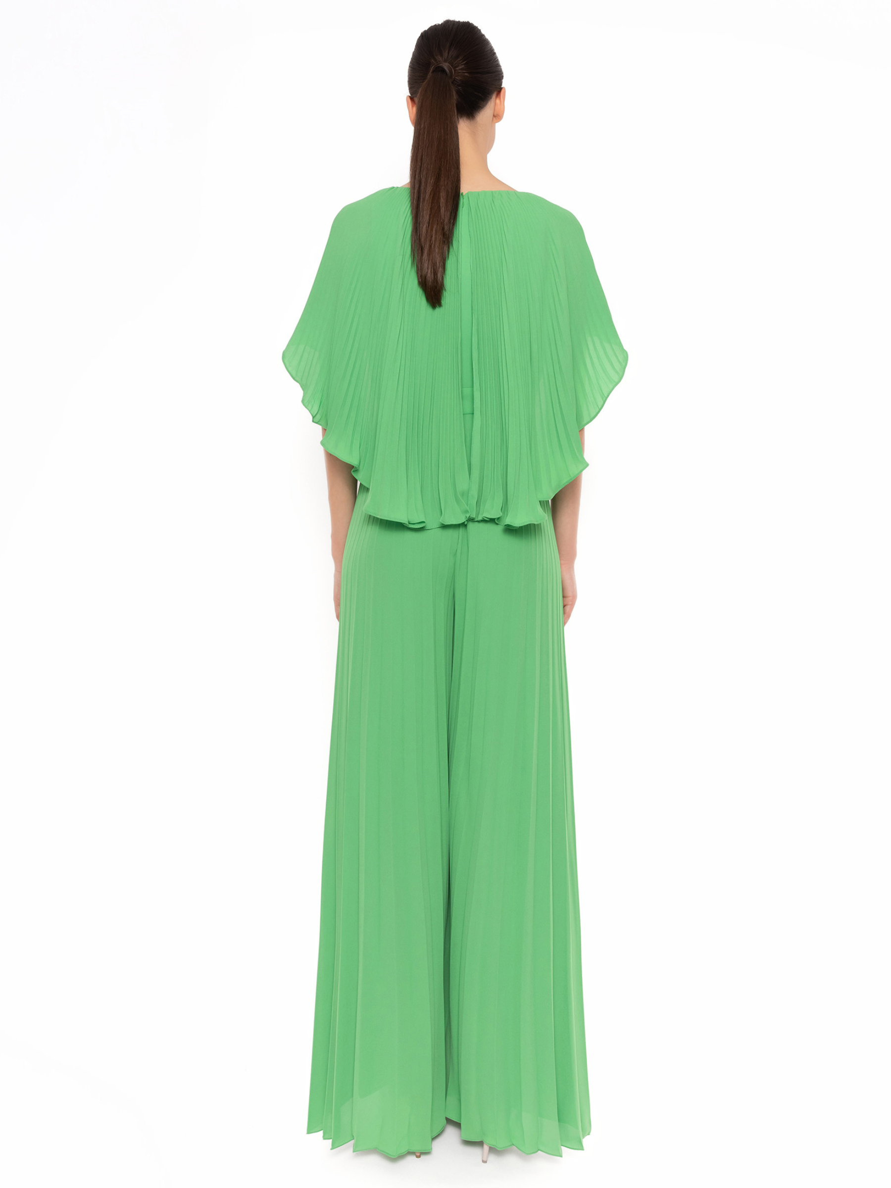 Carla Ruiz 52725 green jumpsuit with cape overlay, pleated wide-leg trousers and defined waist.