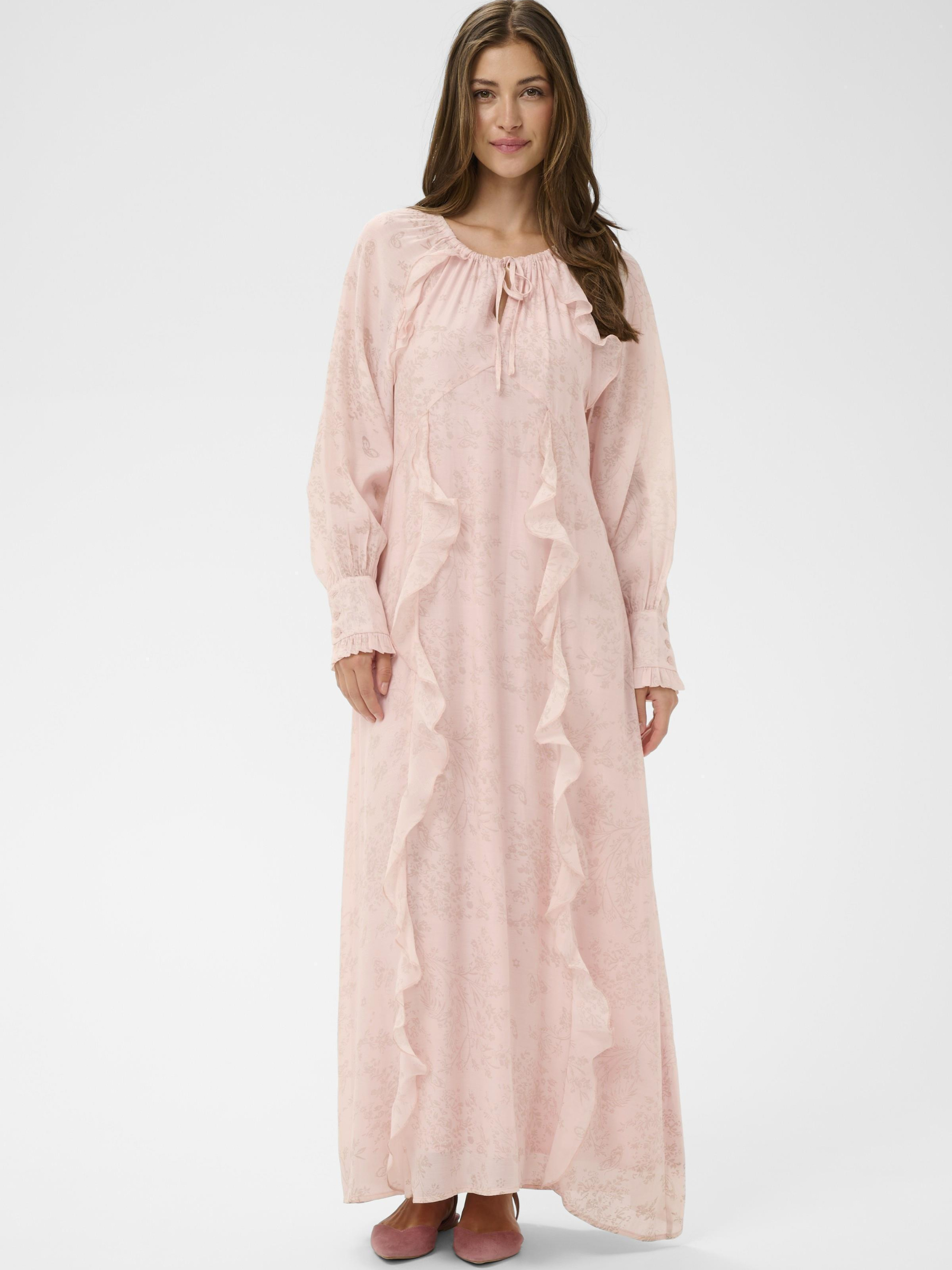 Cream Amy Dress full-length maxi dress with tie neckline and cascading ruffle detailing.