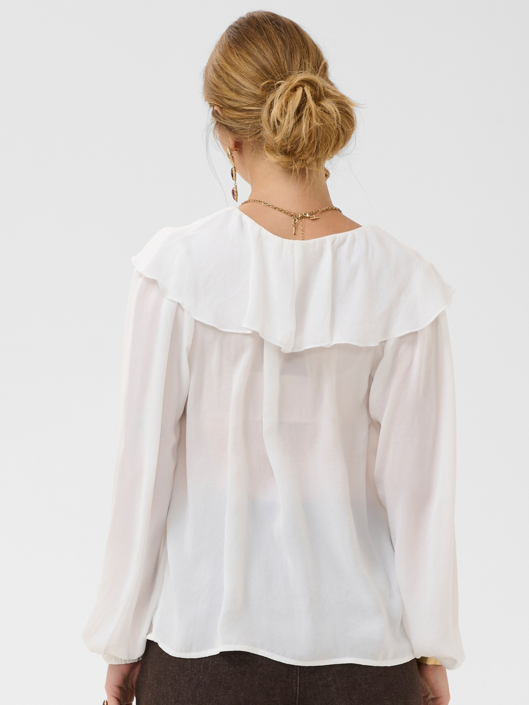 Cream Beliv Blouse with ruffle front detailing and long sleeves in a lightweight fabric.
