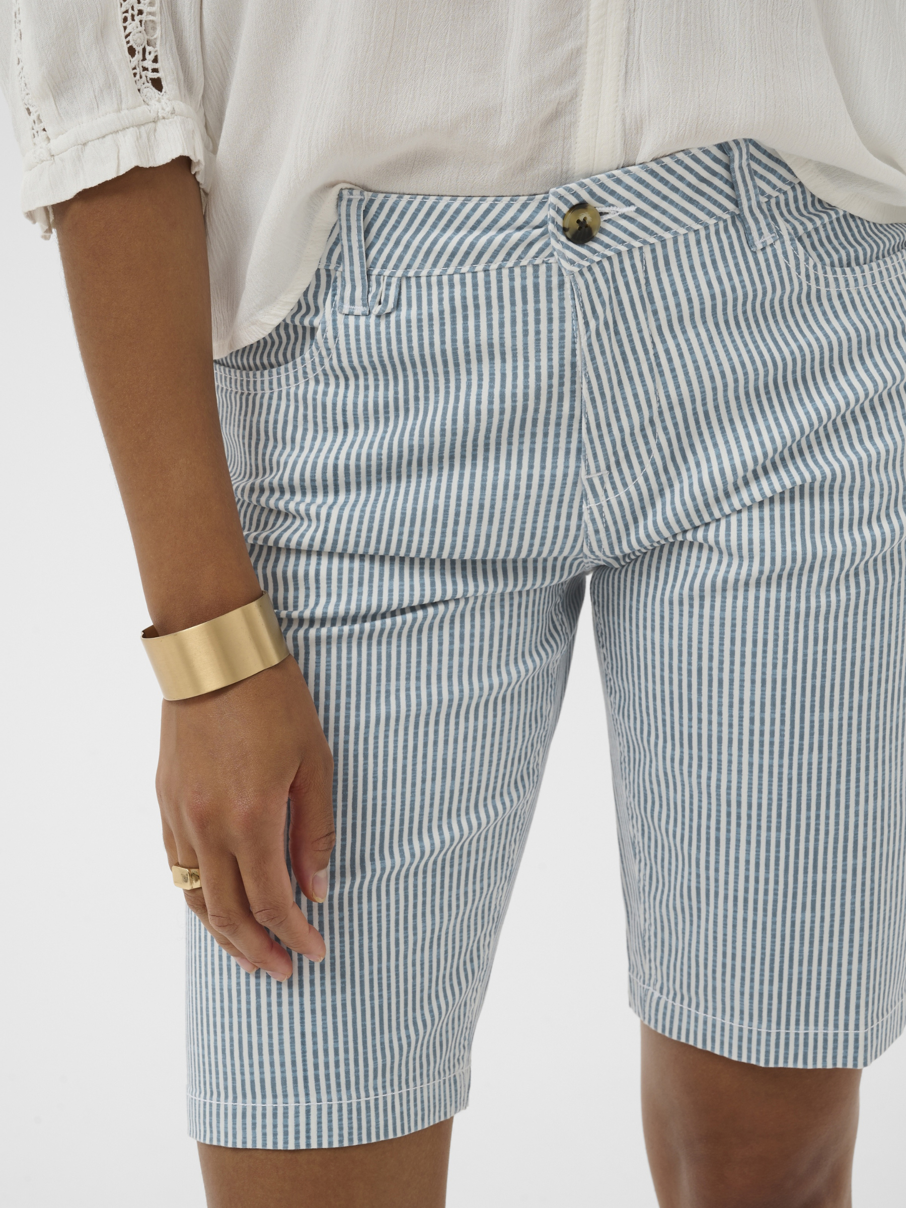 Cream Berta Twill Shorts women’s tailored cotton twill shorts with button fastening and side pockets.