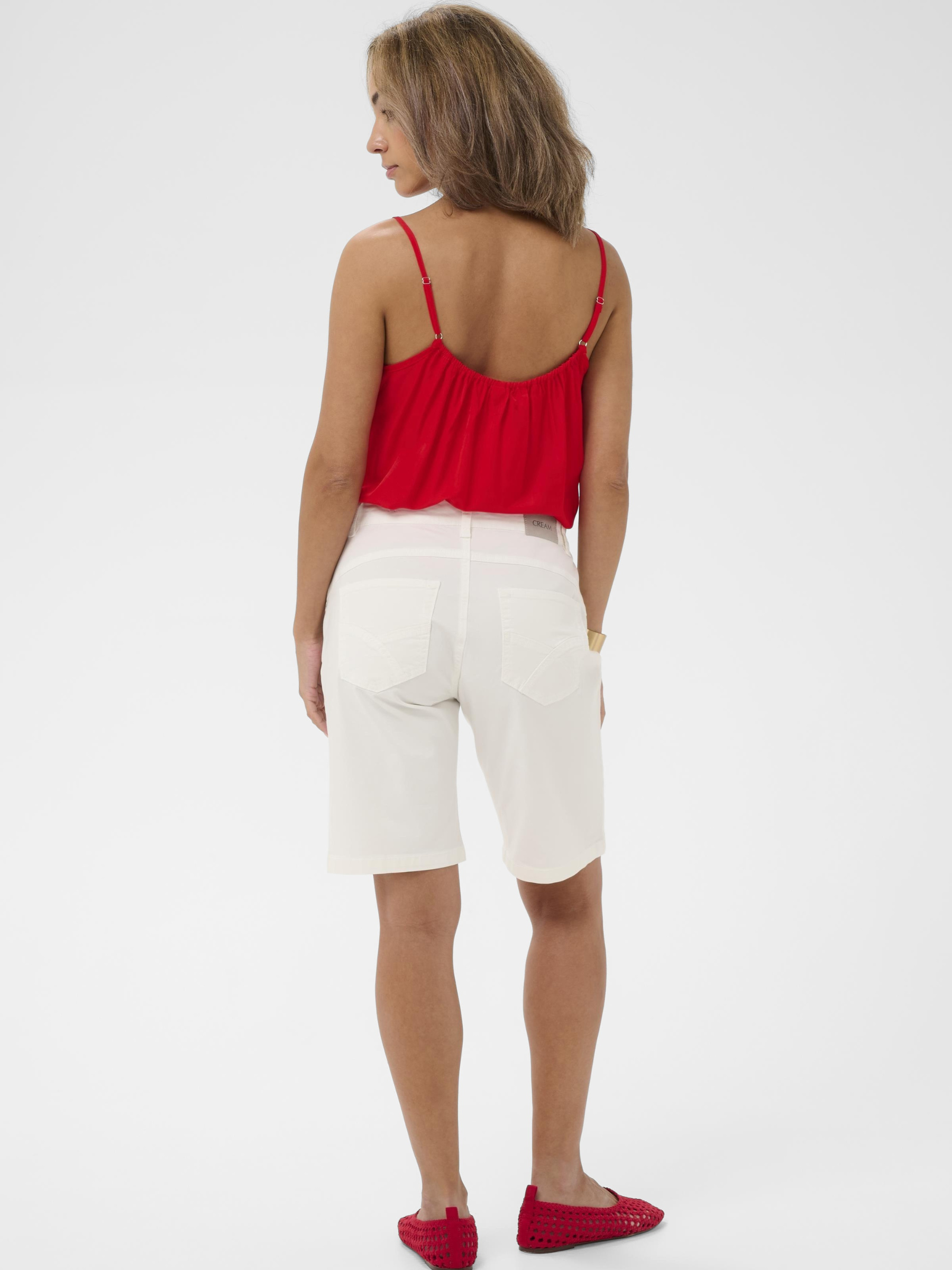 Cream Berta Twill Shorts women’s tailored cotton twill shorts with button fastening and side pockets.