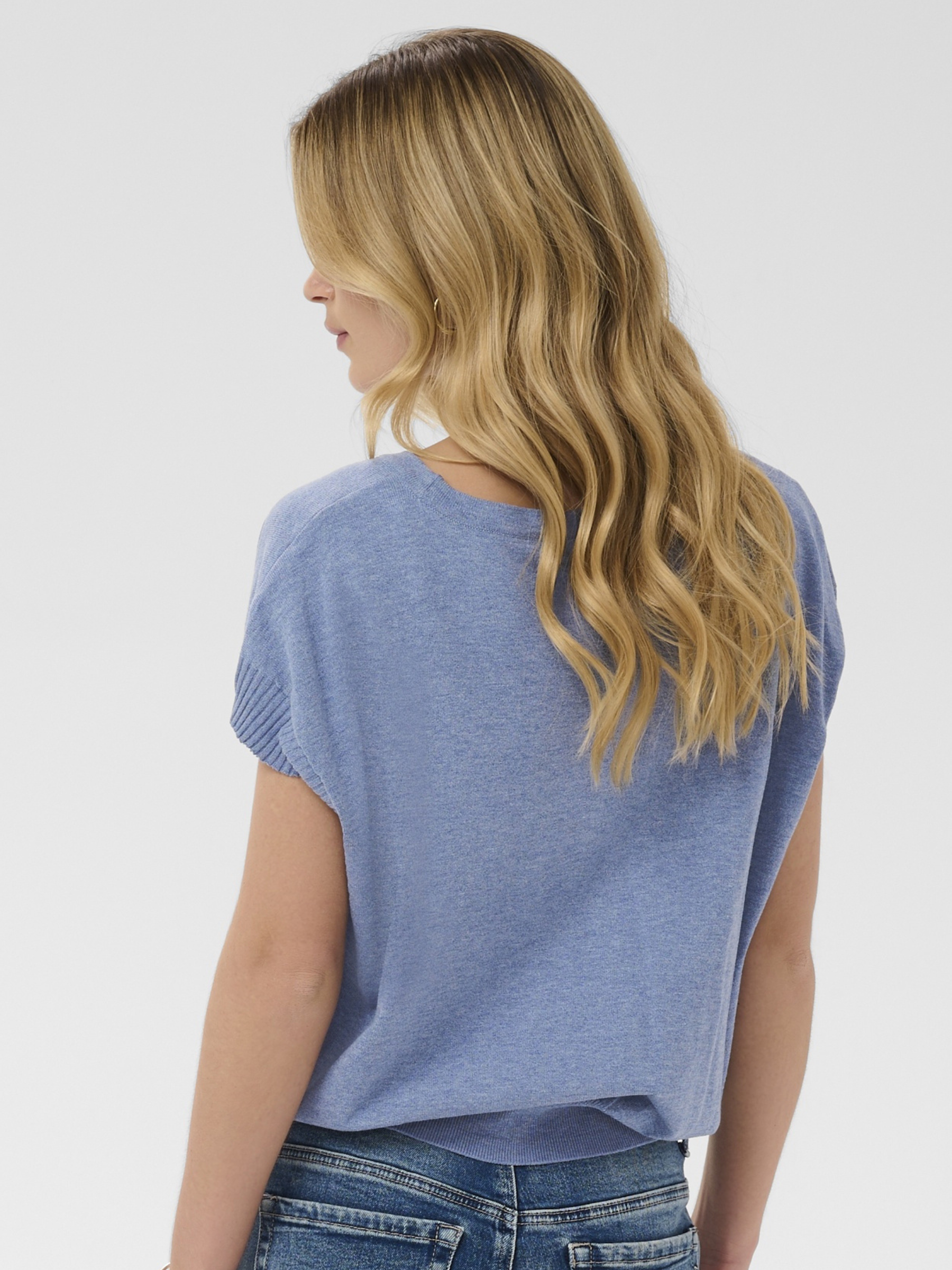 Cream Dela Knit With Deco Slipover lightweight knit top with floral applique detail and short sleeves.
