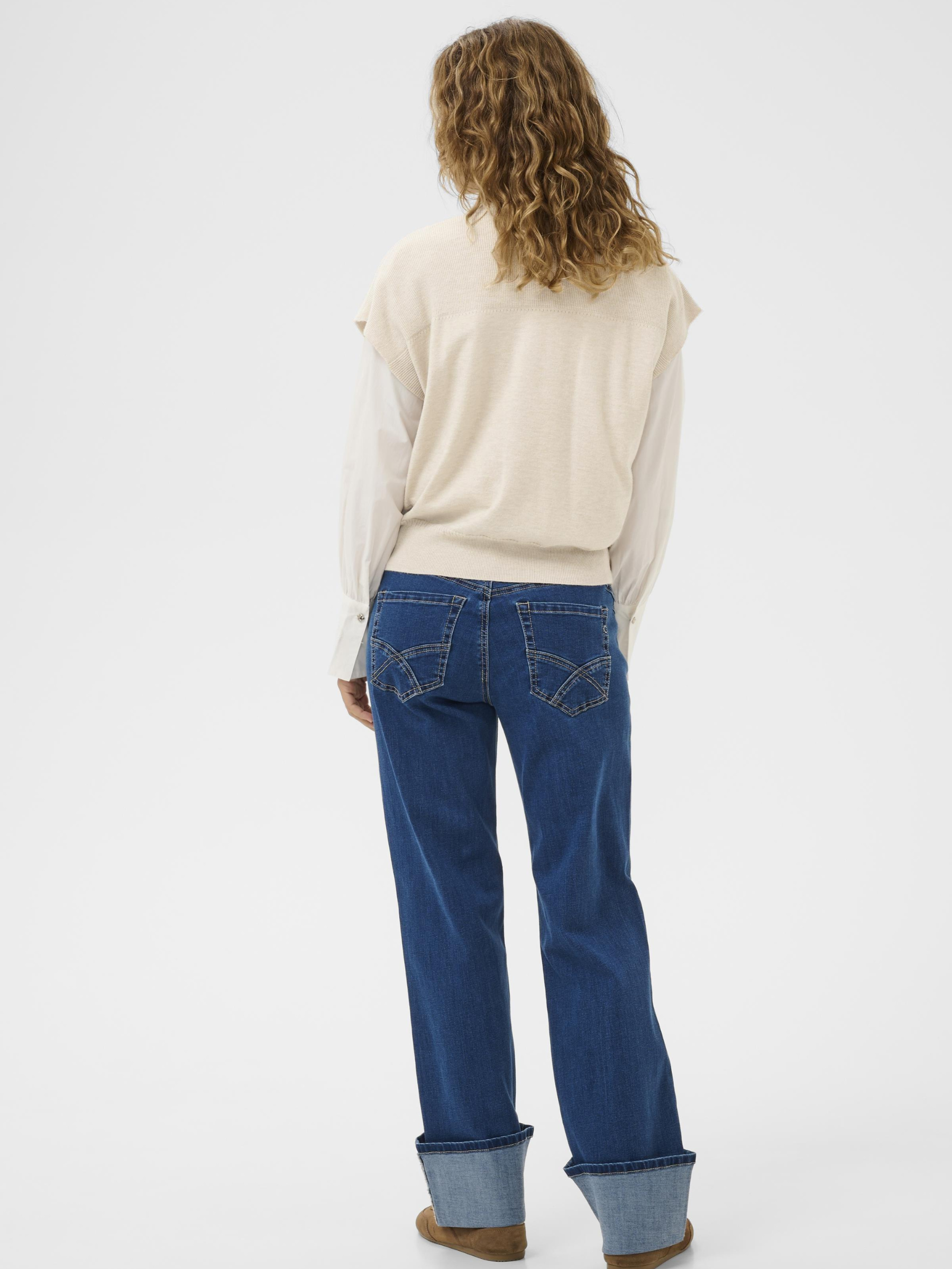 Cream Dela Slipover women’s relaxed fit knitted slipover with sleeveless design and hip-length cut, styled layered over a shirt.