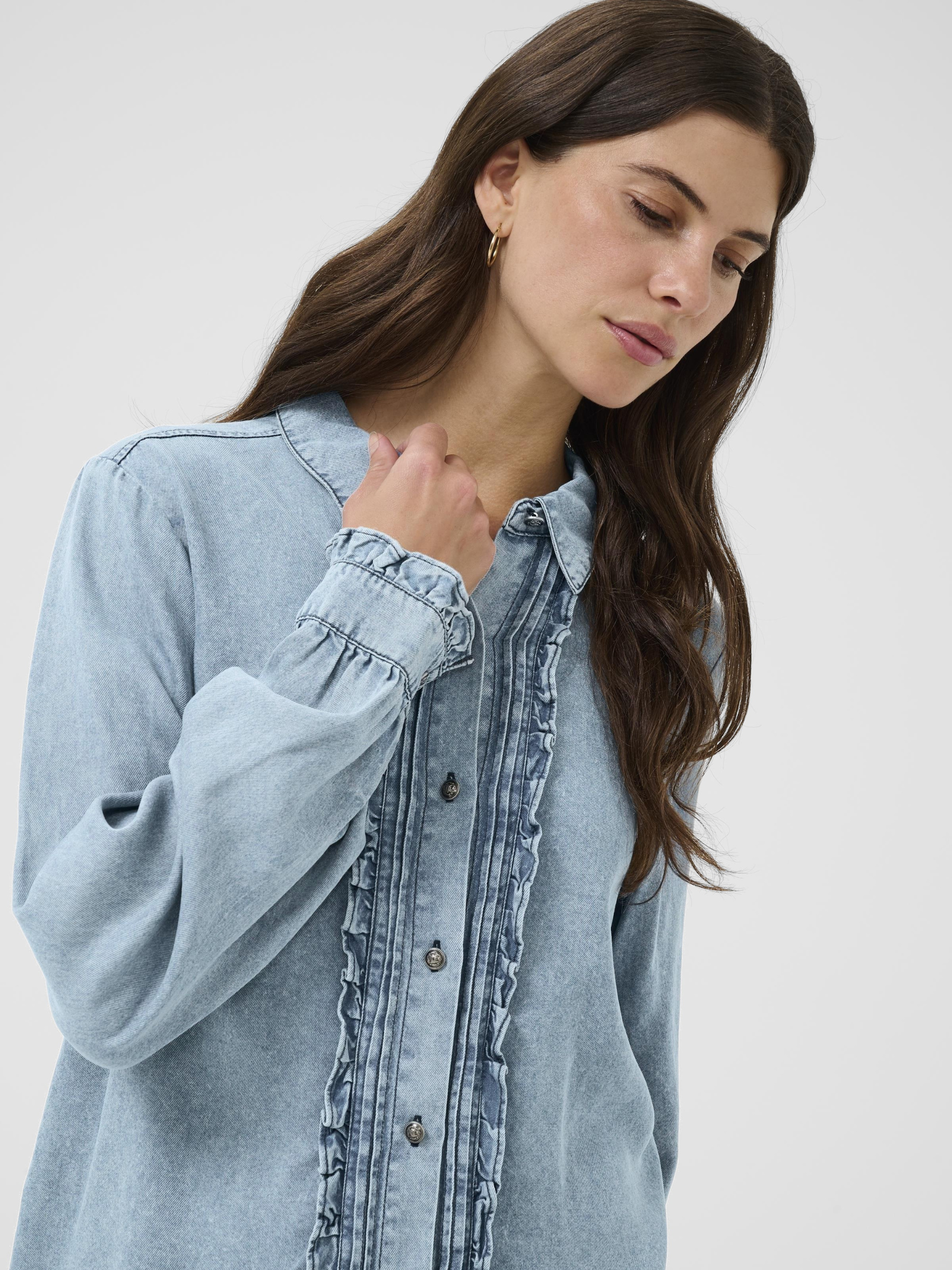 Cream Ellie Blouse women’s lyocell blouse with regular fit, ruffle front detailing and lightweight breathable fabric.