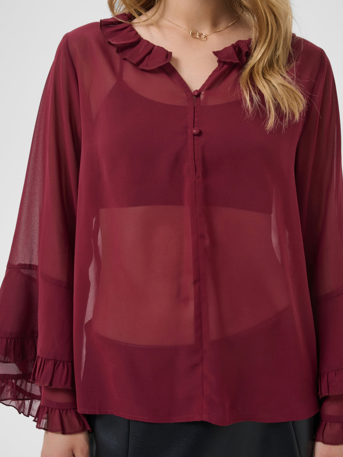 Cream Flouncy Blouse with ruffle neckline, button front and layered flared sleeves.