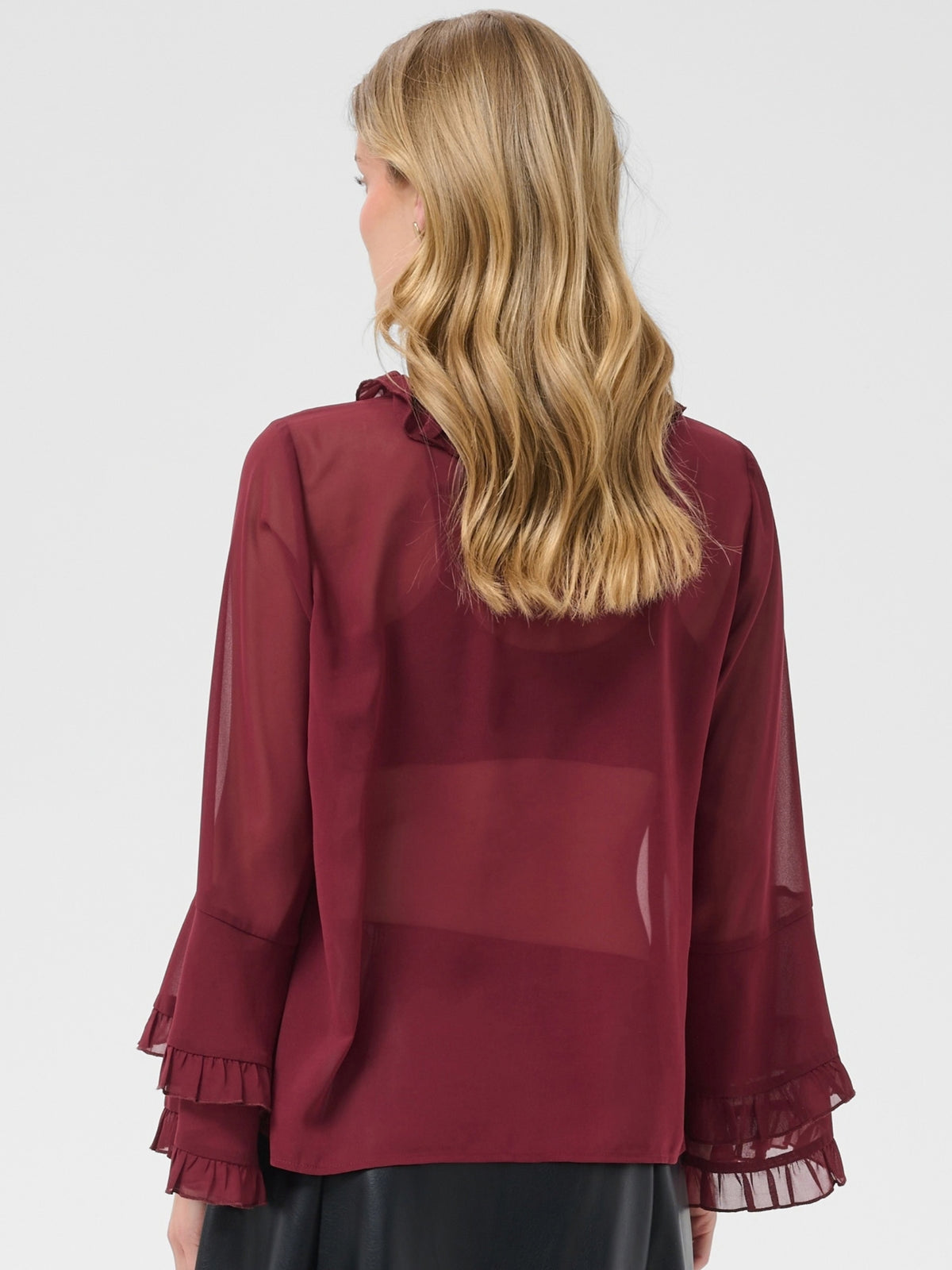 Cream Flouncy Blouse with ruffle neckline, button front and layered flared sleeves.