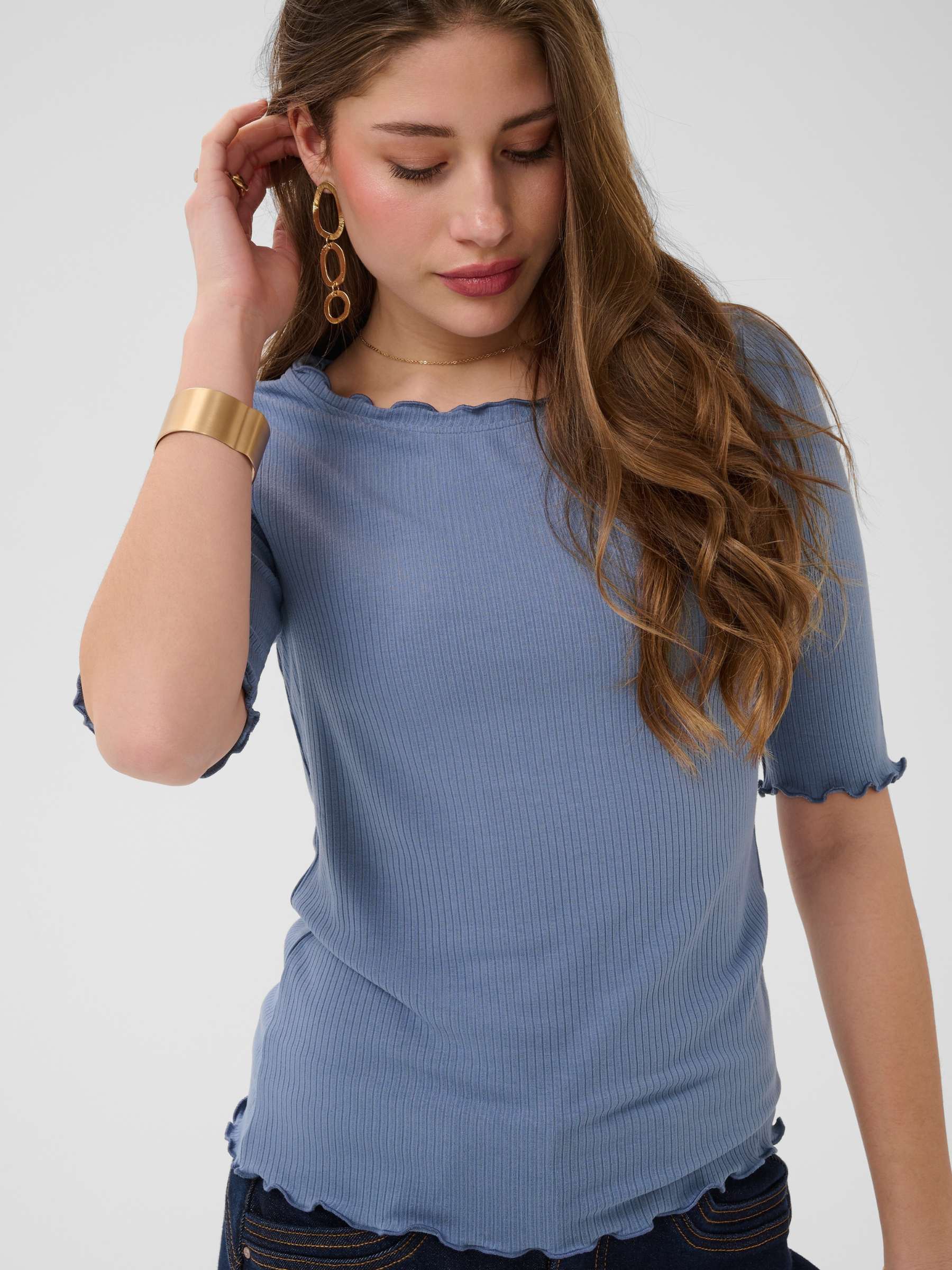 Cream Ribba S/S Blouse ribbed slim fit top with frill neckline and elbow-length sleeves.
