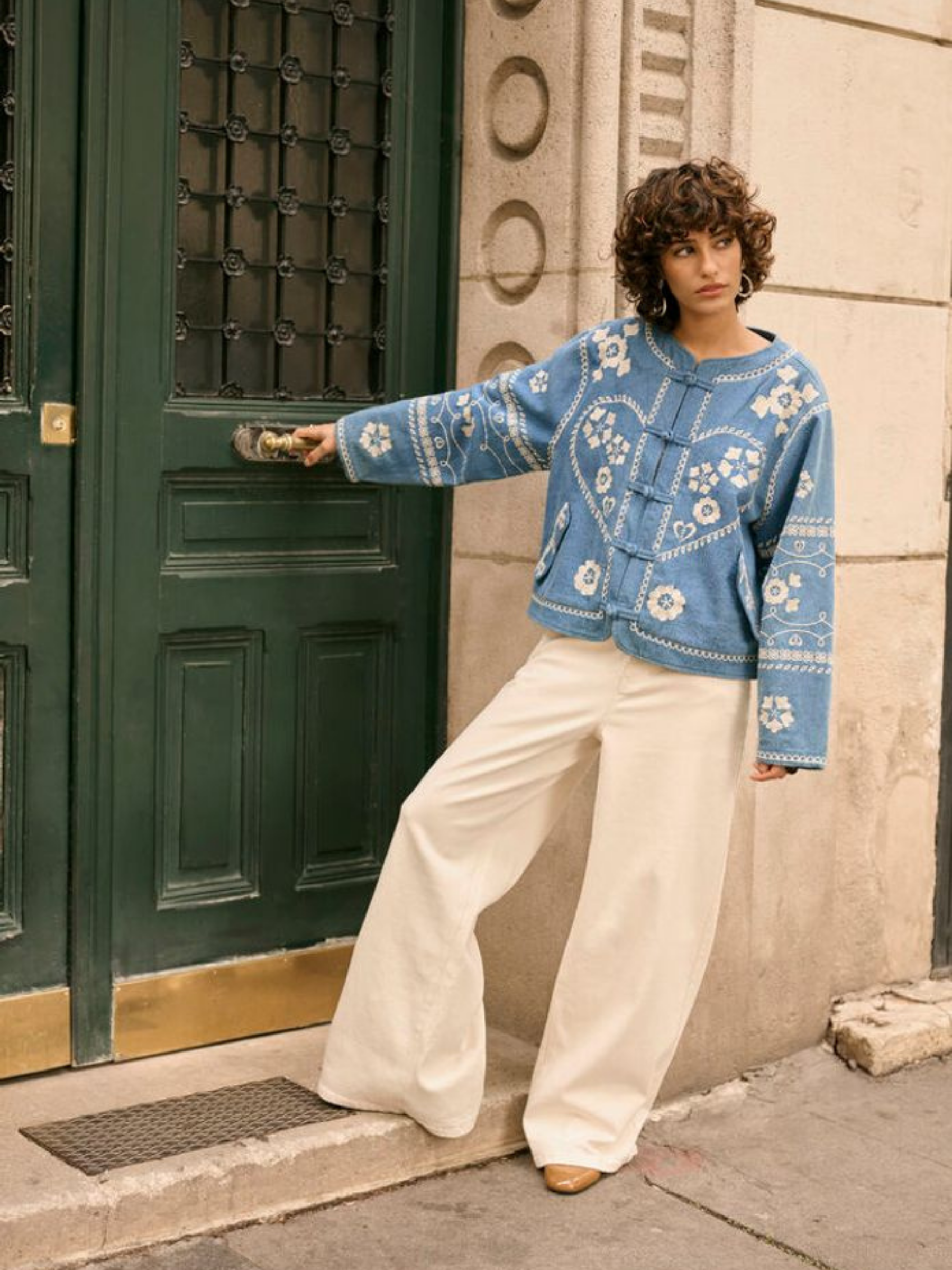 Cream Tannie Jacket women’s loose-fit cotton jacket with decorative detailing, hip-length cut and functional pockets, styled casually.