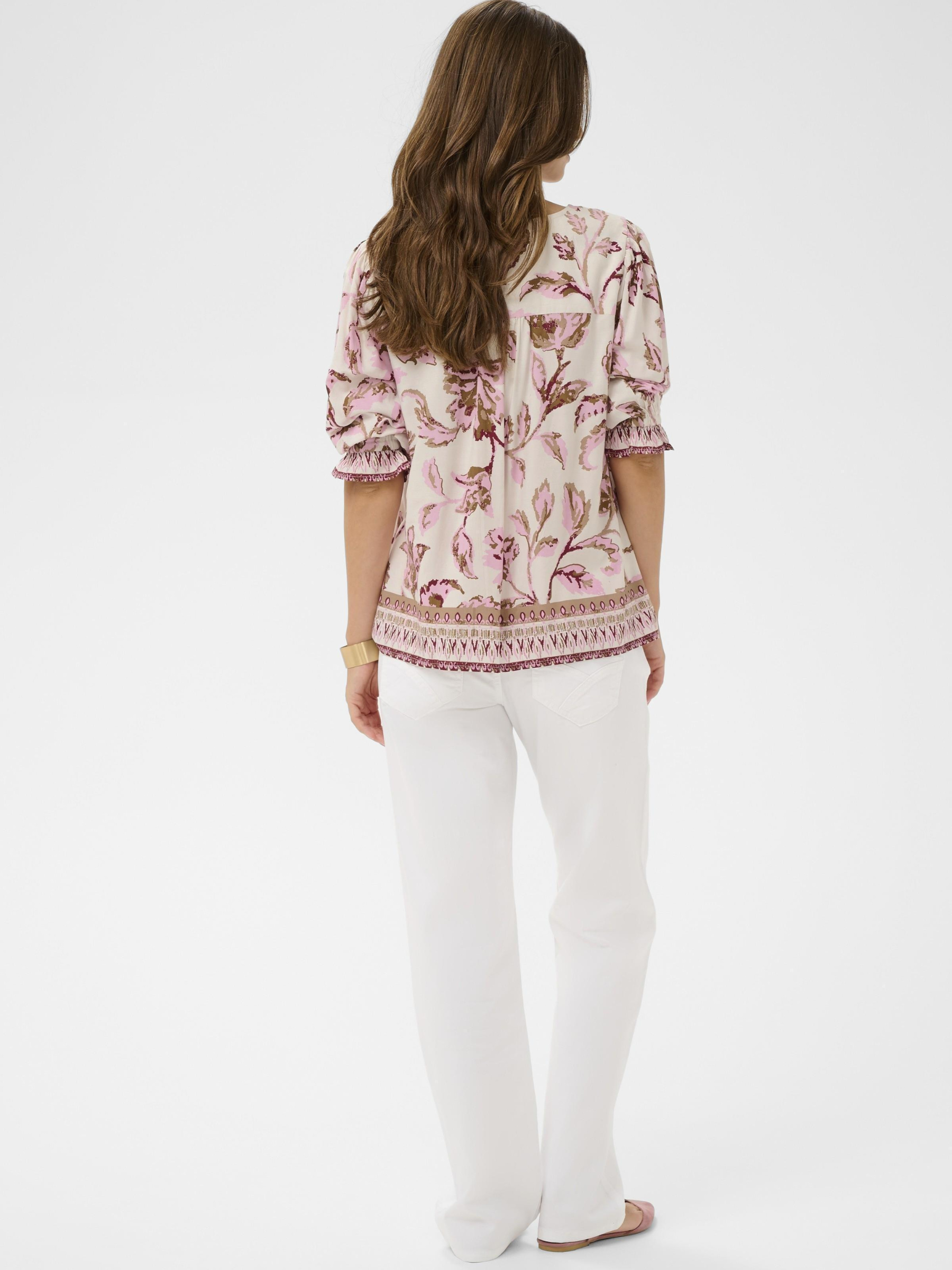 Cream Tiah Boho blouse with V-neck ruffle trim, puff sleeves and decorative border print in lightweight viscose.