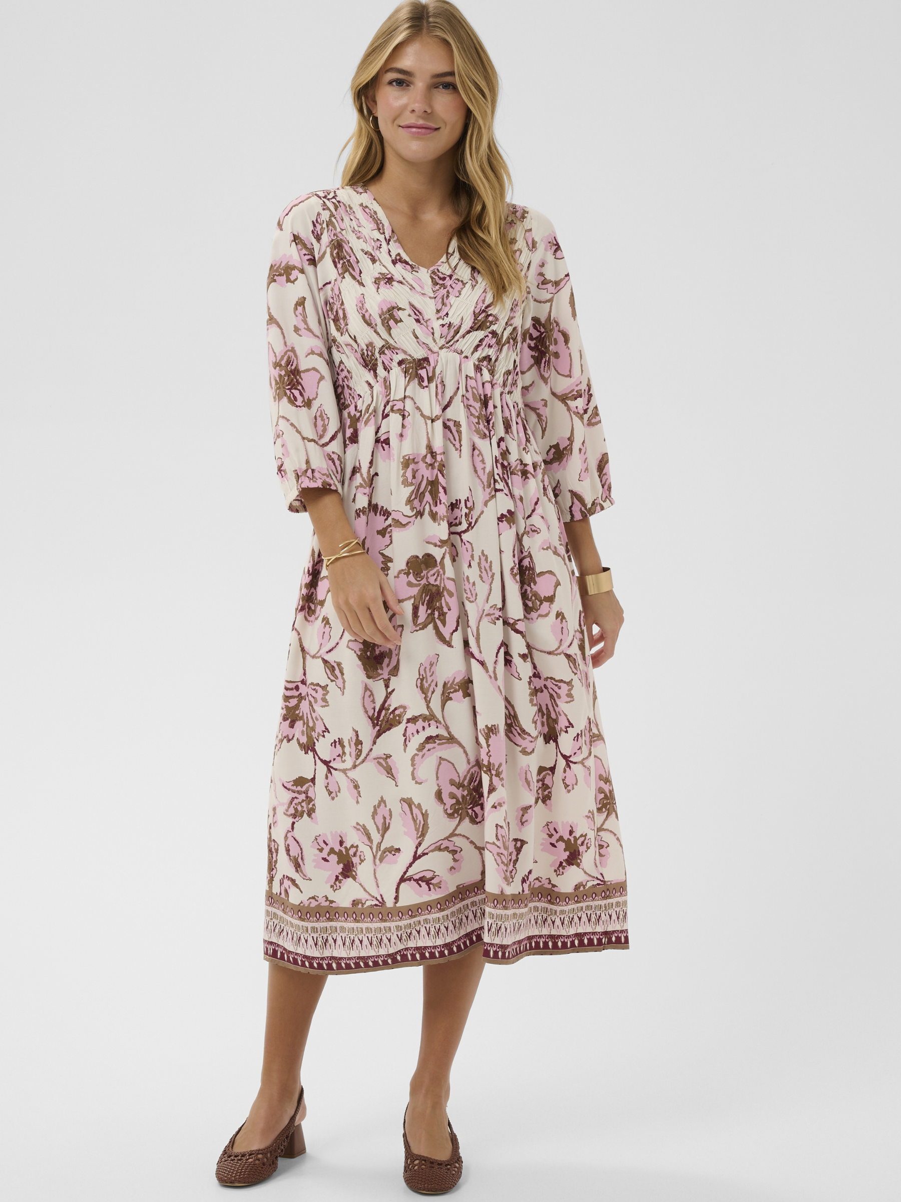Cream Tiah Smock Dress printed midi dress with V-neckline, empire waist and three-quarter sleeves.