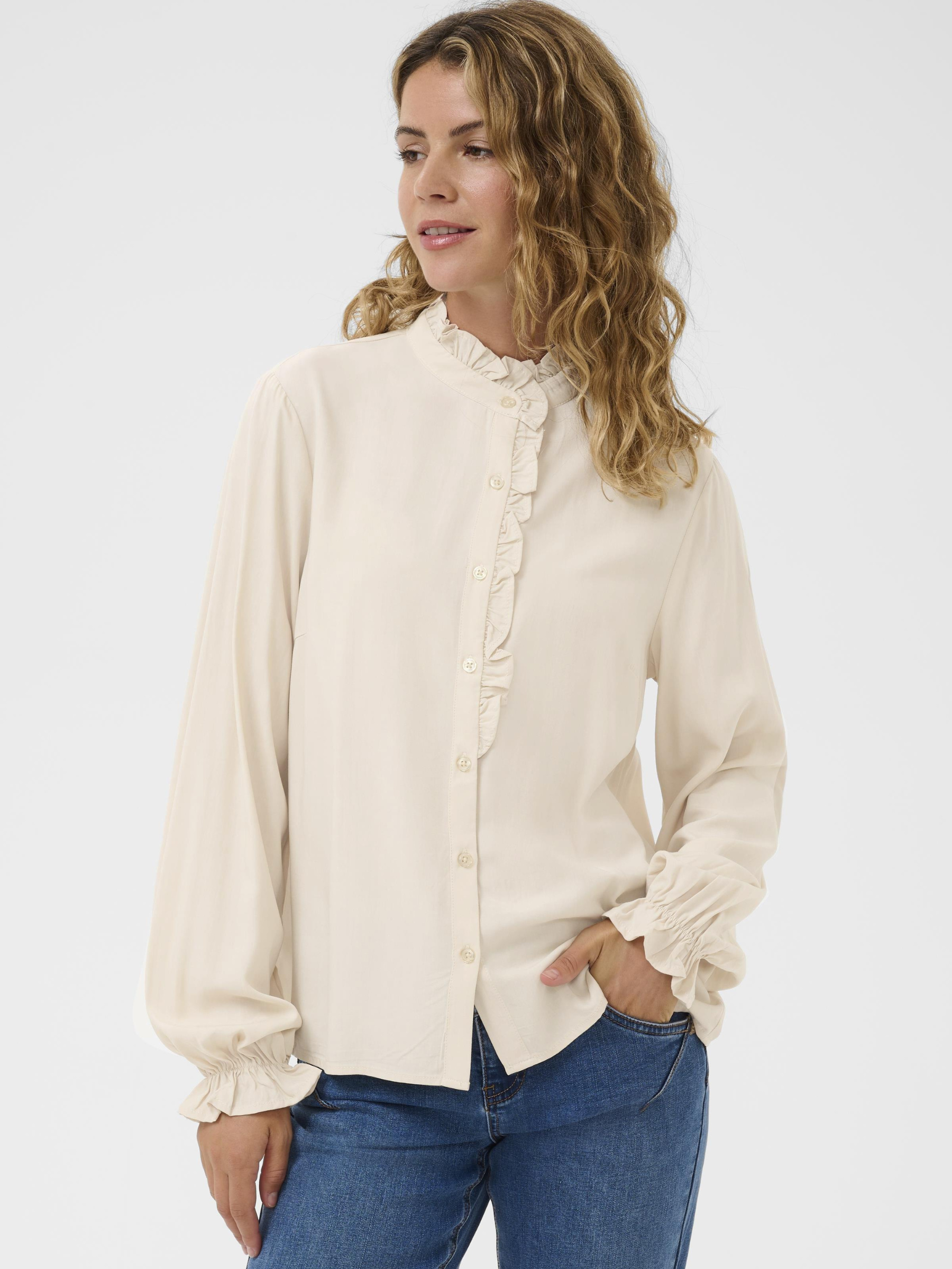 Cream Venea Shirt, women’s straight fit viscose blouse with long sleeves and hip-length cut, styled with jeans for a smart casual look.