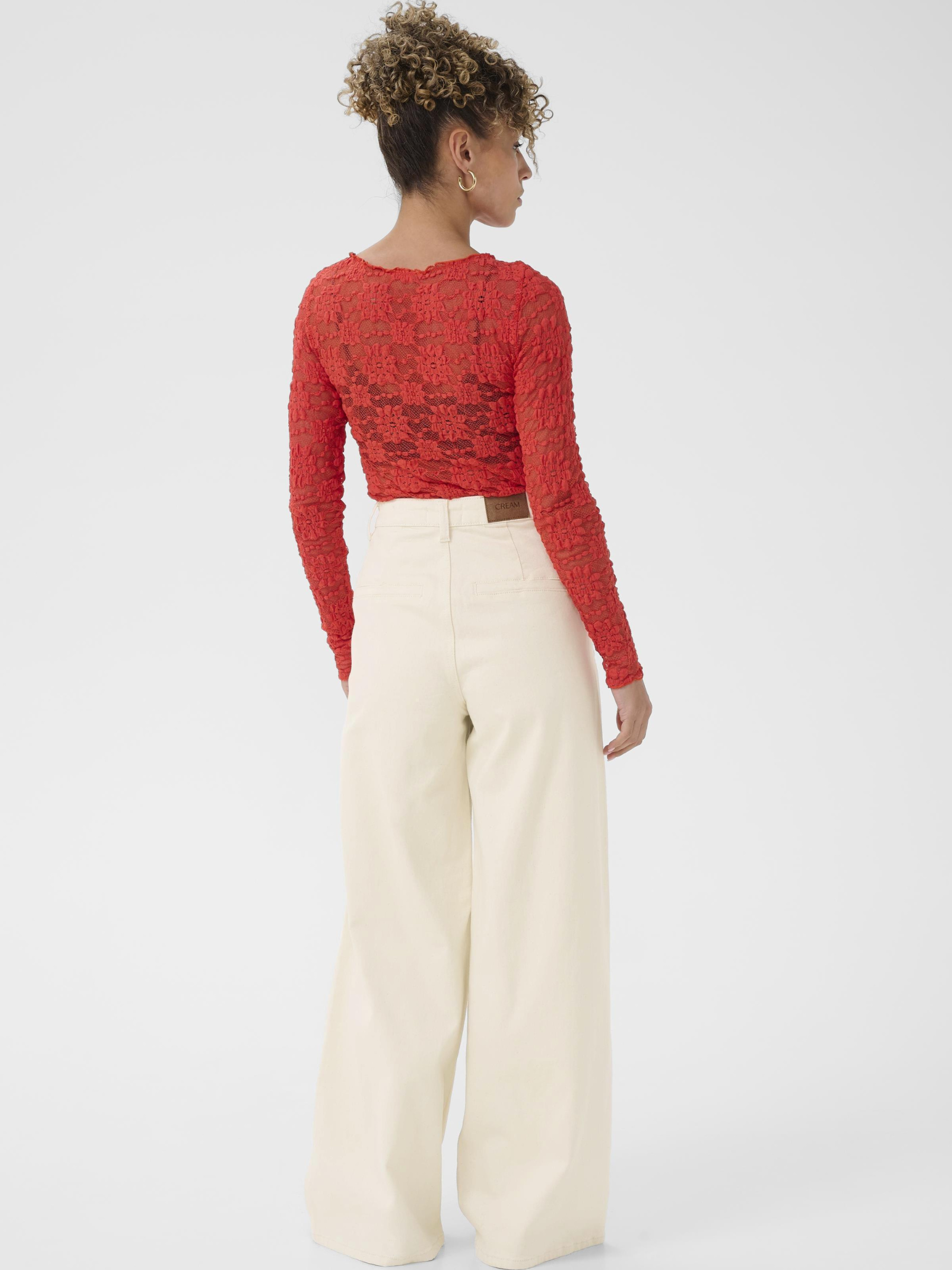 Cream Visti Twill Pant women’s high-waist full-length cotton twill trousers with straight leg fit, styled with a lace blouse.