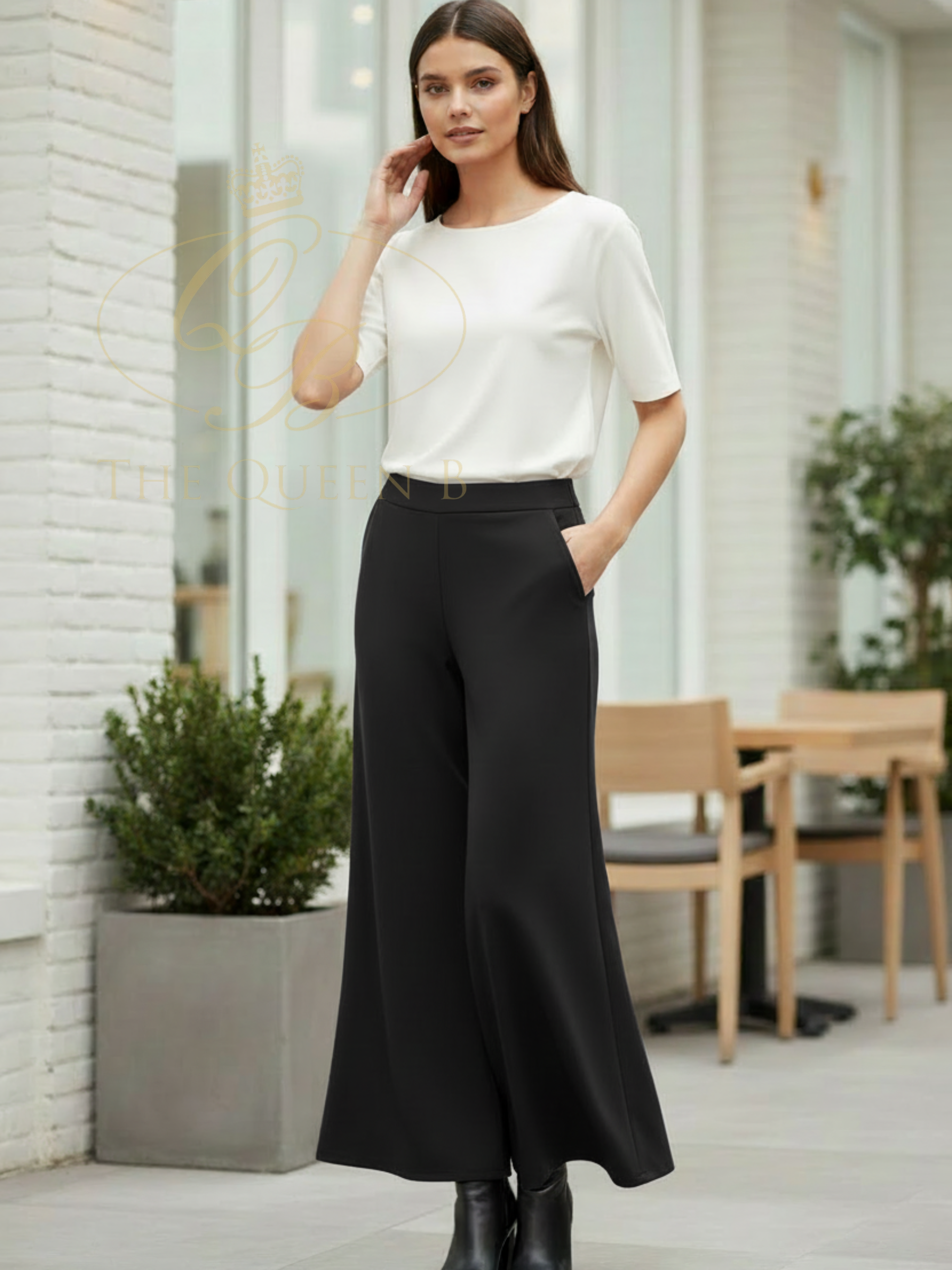 Deck By Decollage 2189 flare trousers with high-rise waistband and fluid full-length silhouette.