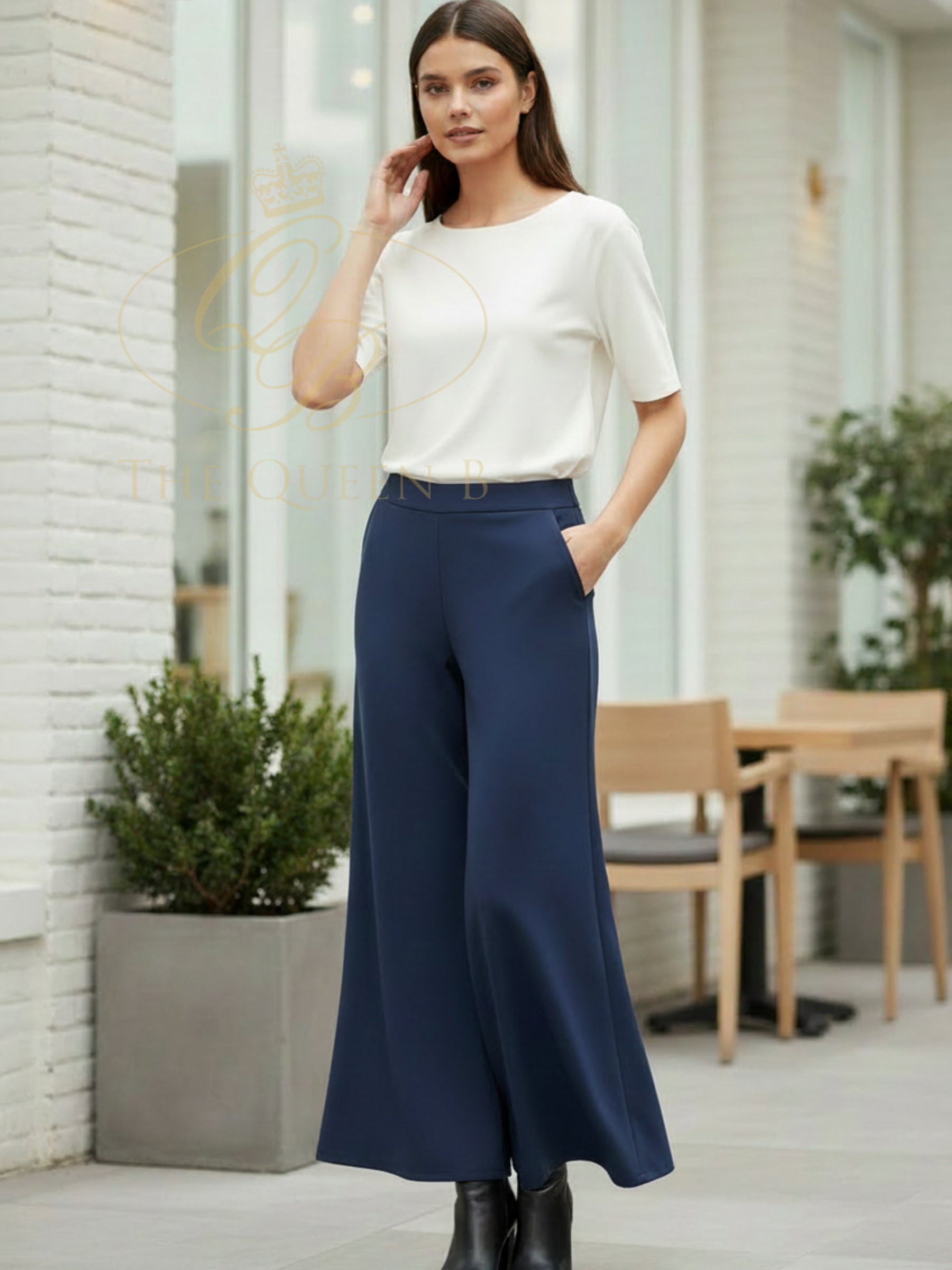 Deck By Decollage 2189 flare trousers with high-rise waistband and fluid full-length silhouette.