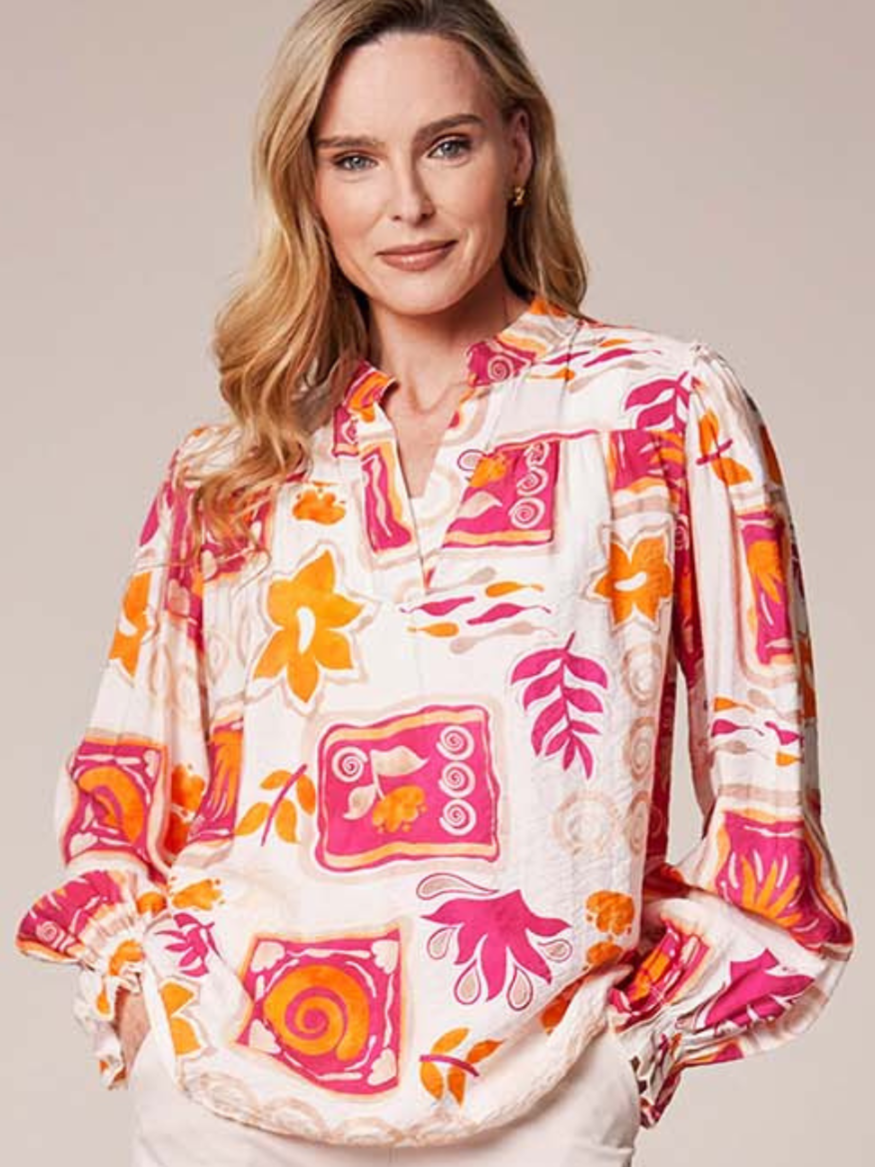 Deck By Decollage MC18022S printed blouse with notch neckline and long sleeves in lightweight fabric.