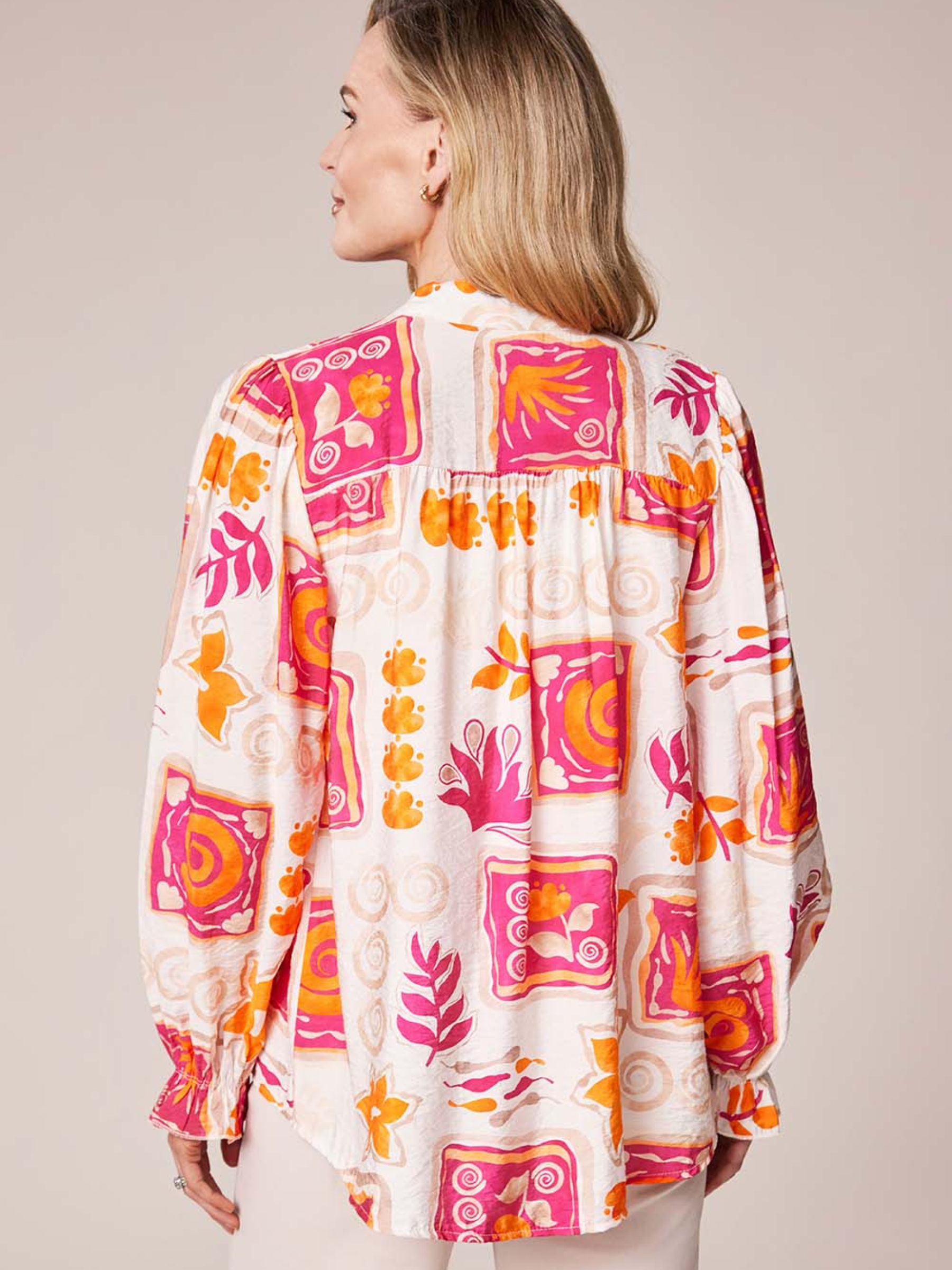 Deck By Decollage MC18022S printed blouse with notch neckline and long sleeves in lightweight fabric.