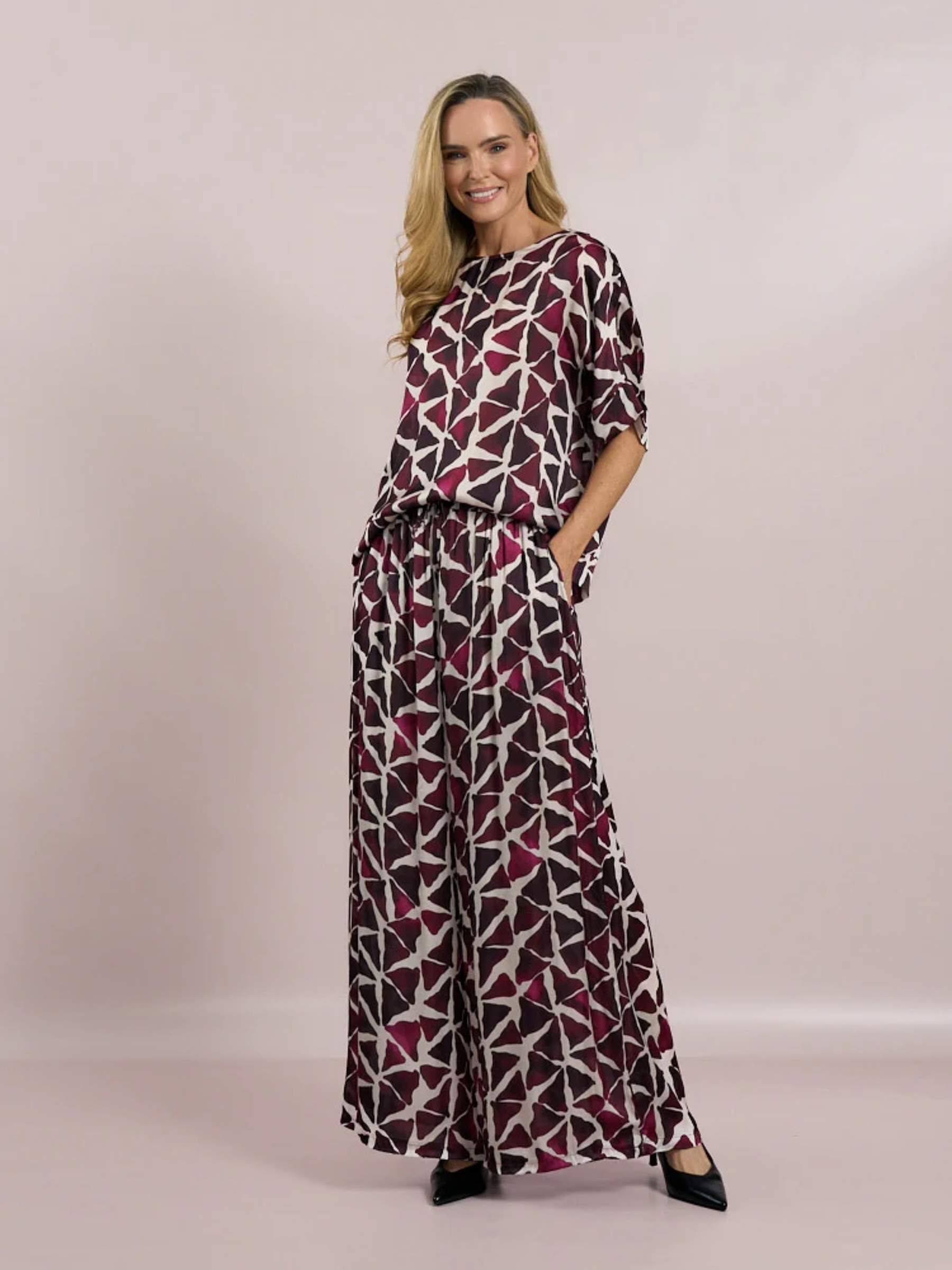 Deck by Decollage abstract Mulberry printed top in berry and neutral tones, featuring a wide neckline and relaxed silhouette. Made from lightweight viscose for breathable comfort-perfect for bold, contemporary styling or matching co-ord looks.