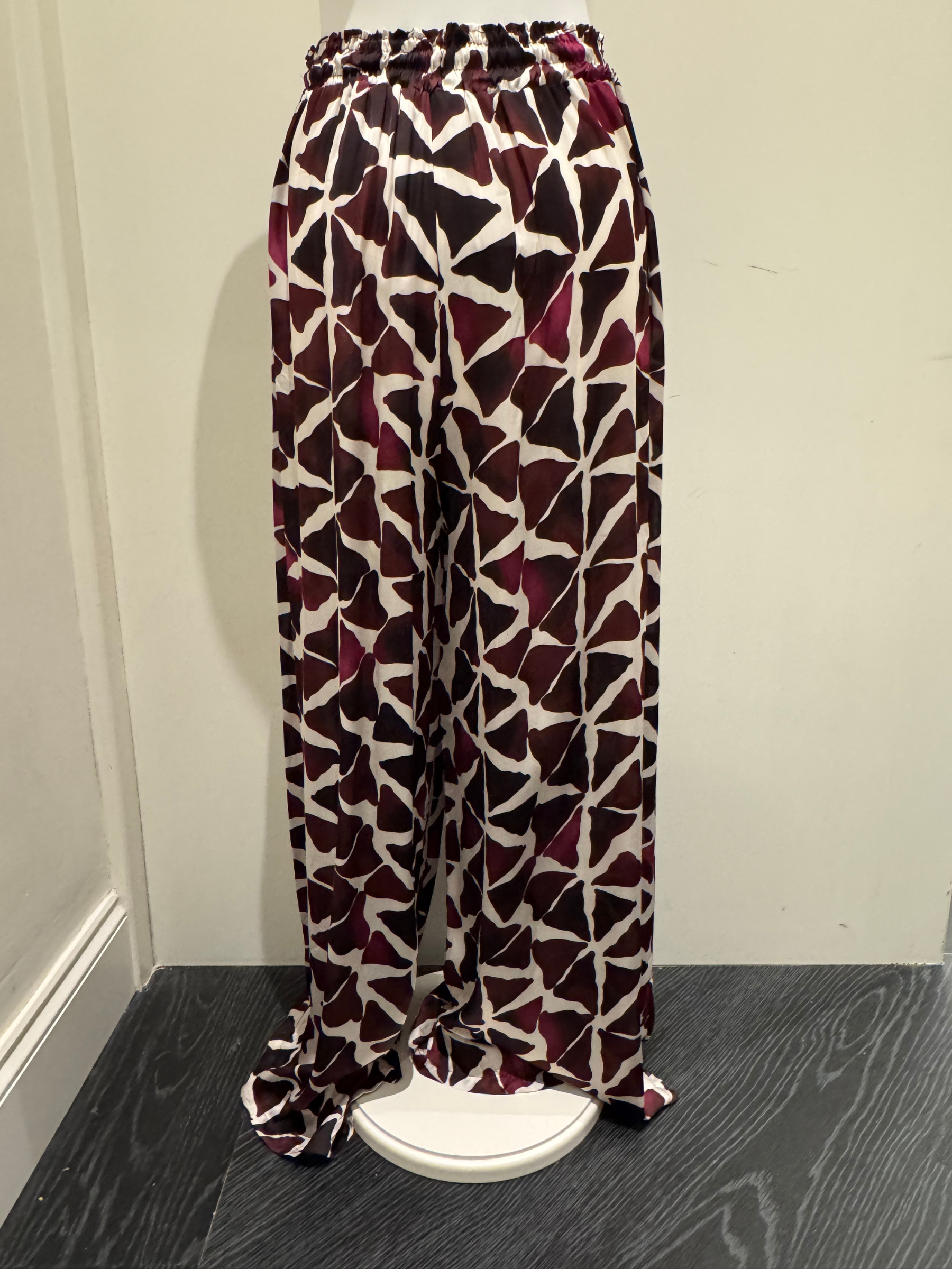 Deck by Decollage wide-leg trousers with an abstract berry and ivory print, featuring an elasticated waistband and fluid silhouette-designed for bold, stylish comfort.