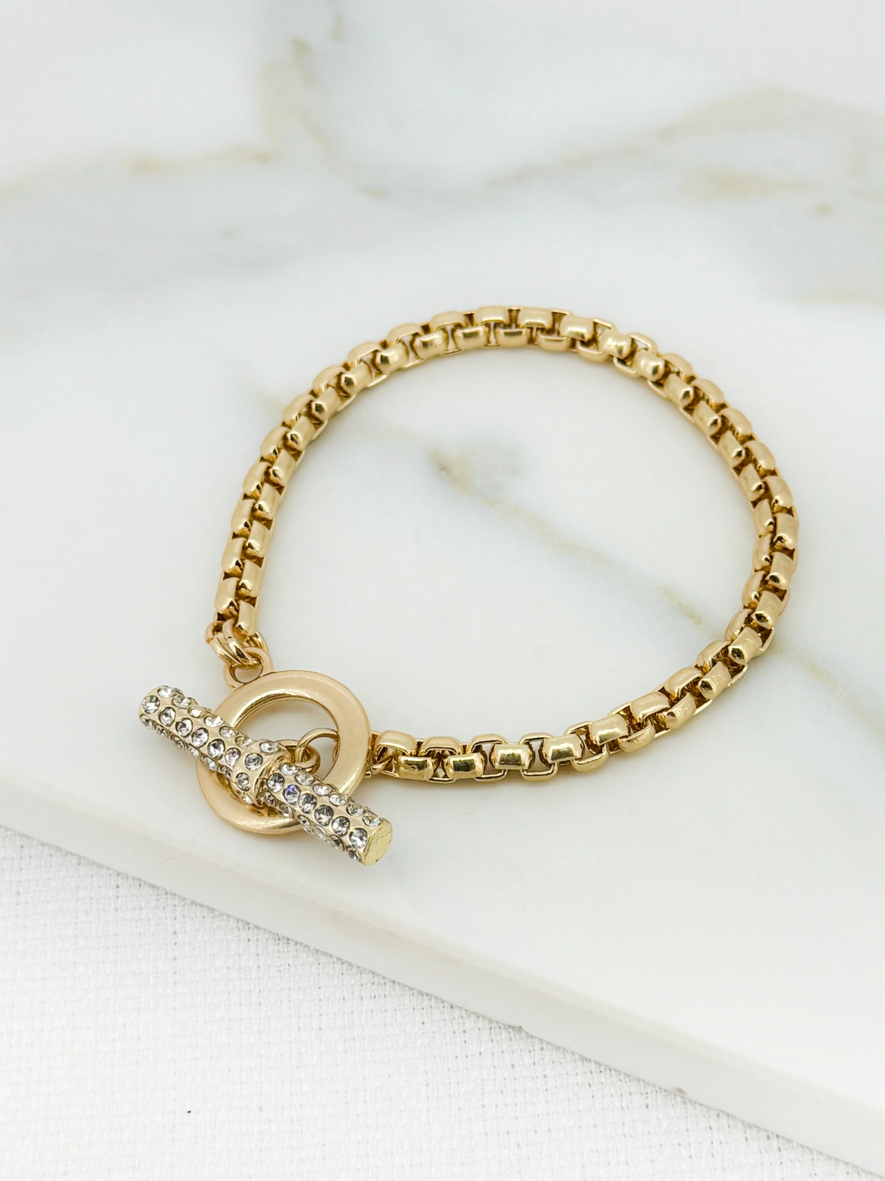 Envy 4640 Gold Bracelet featuring a gold-effect chain link design with a sparkling embellished toggle clasp, elegant women’s fashion bracelet ideal for day-to-night styling.