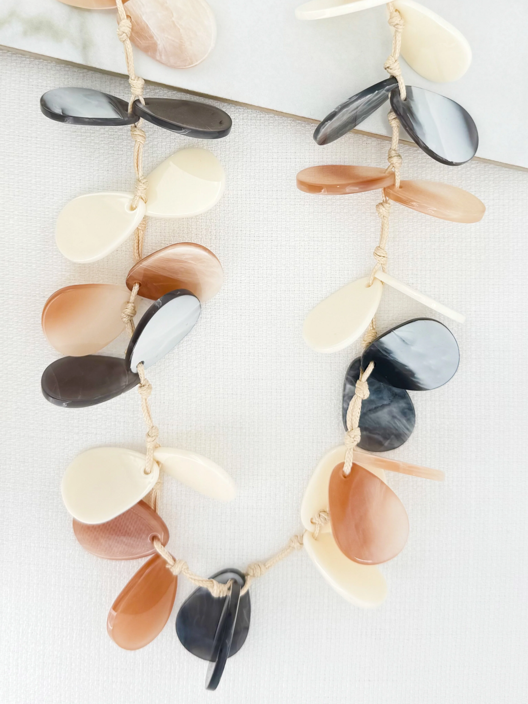 Envy 4721 Long Resin Necklace with layered organic resin shapes in a long statement design.