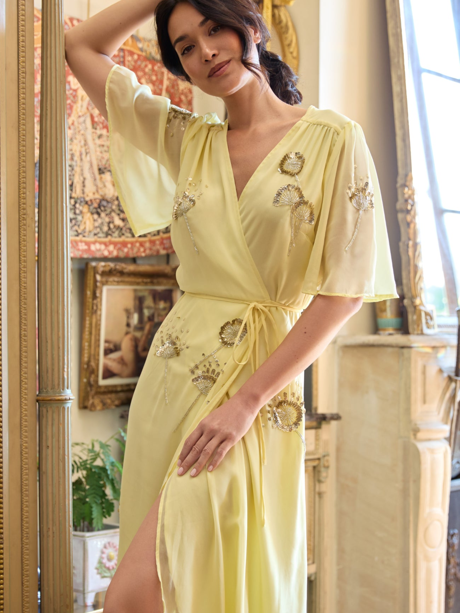 Hope & Ivy Joy Yellow Dress with wrap silhouette, flutter sleeves, embellished detailing and flowing maxi skirt.