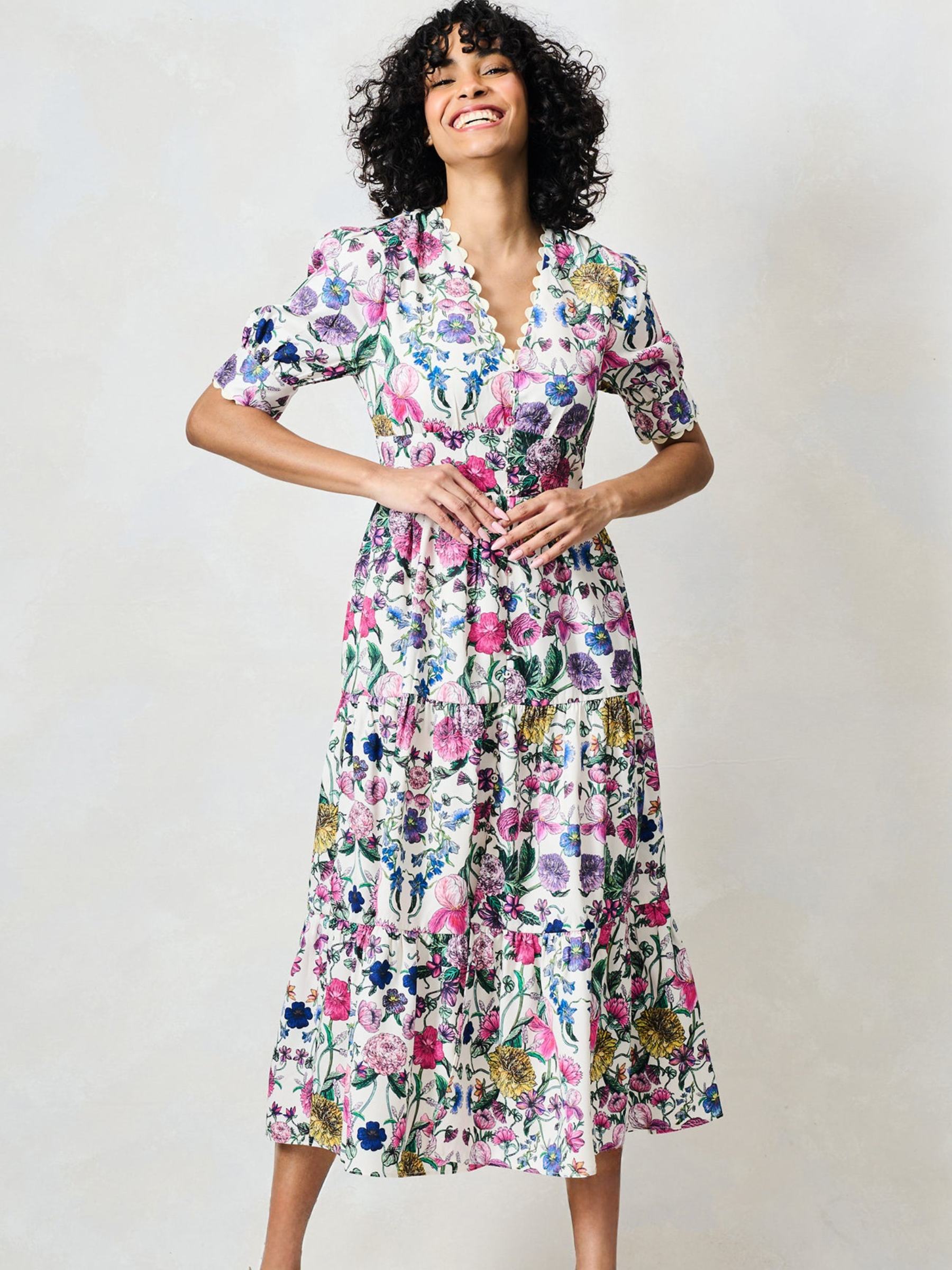 Hope & Ivy Sonnet White Floral Dress with V neckline, puff sleeves, fitted waist and flowing midi skirt.