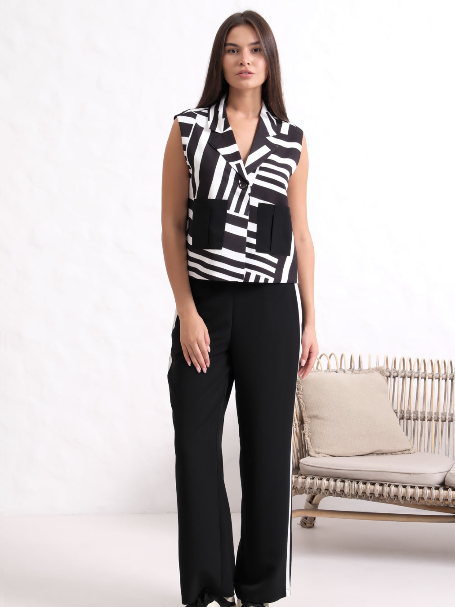 Inco 1219 sleeveless waistcoat with monochrome print, lapel collar and contrasting front pockets.