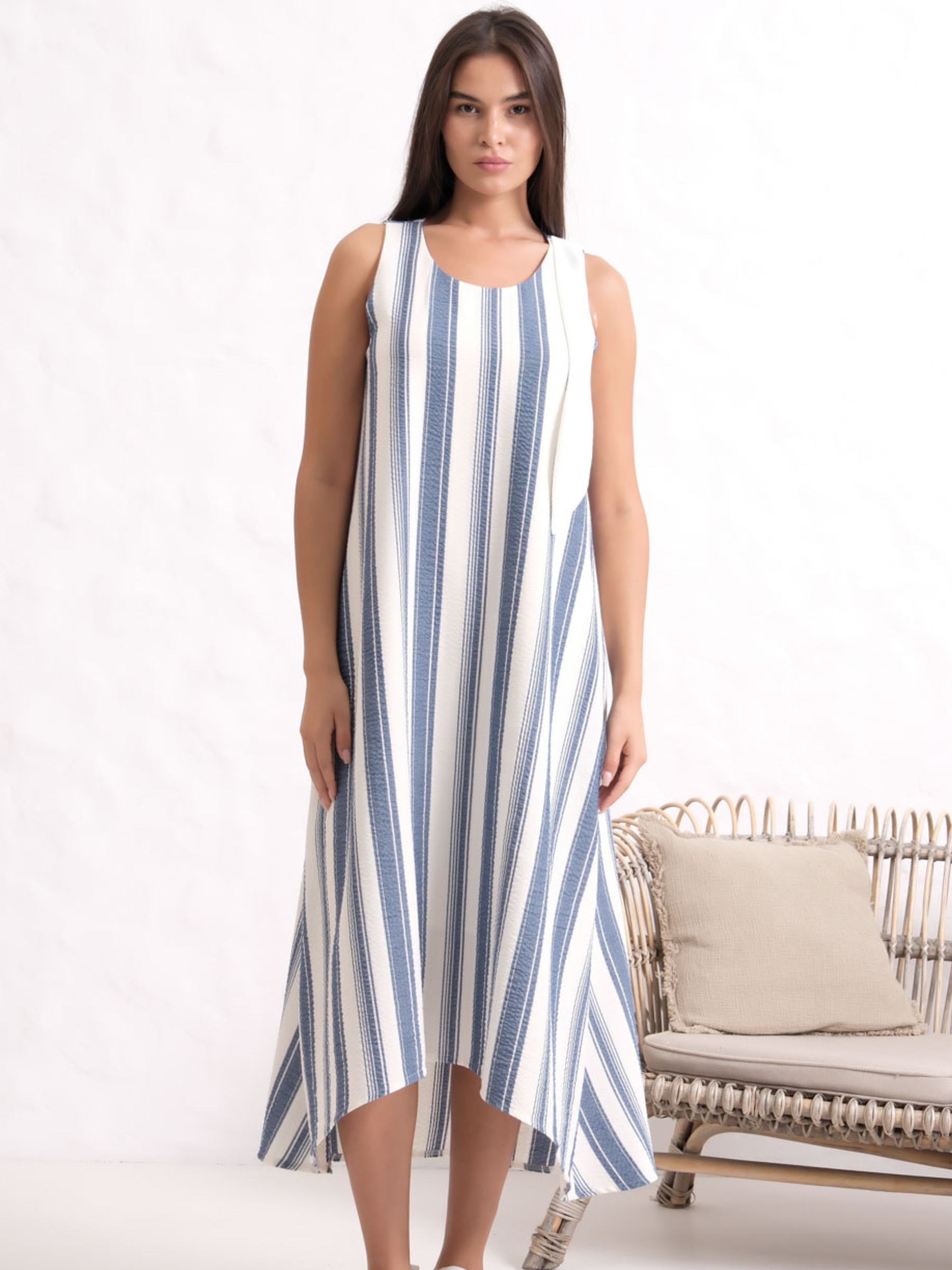 Inco 2161 Sleeveless Dress with A-line silhouette, round neckline and asymmetric hem.