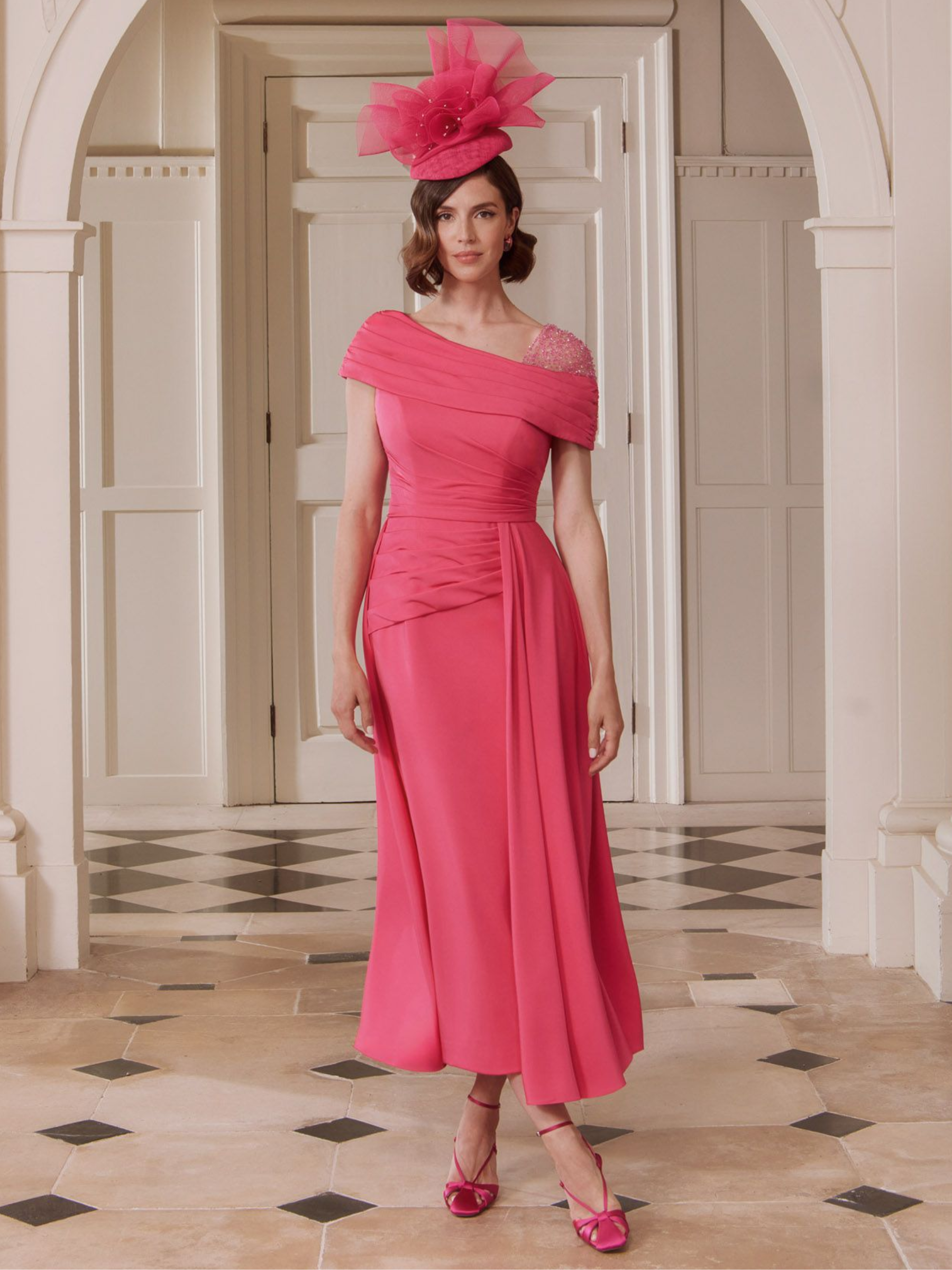 John Charles 29346B Persian Rose Dress with asymmetric draped neckline, beaded shoulder detail and flowing A-line midi skirt — a vibrant occasionwear choice for weddings and special events.
