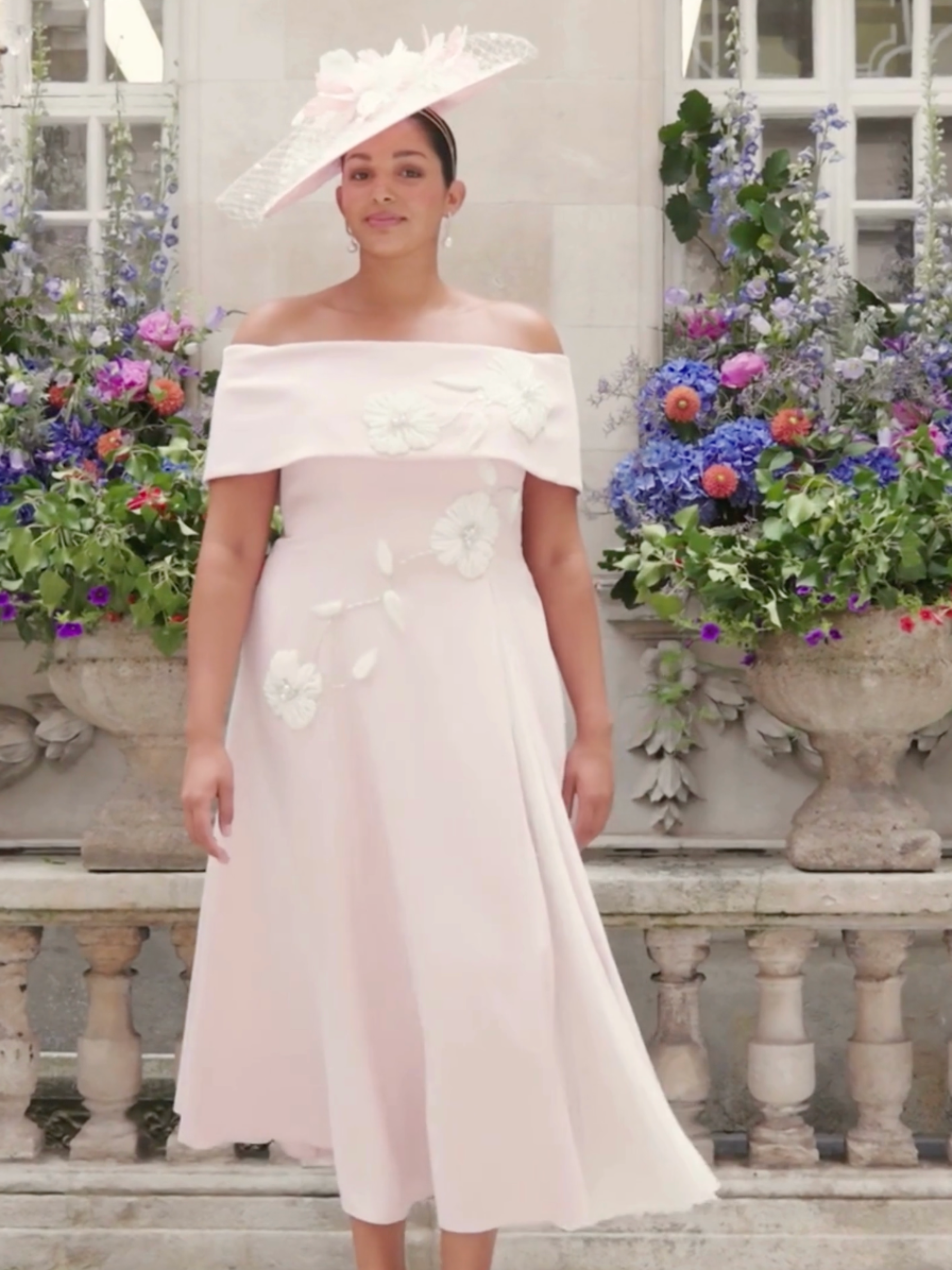 John Charles 29358 Petal/Ivory Dress with bardot neckline, A-line midi skirt, plissé chiffon godet and contrast floral appliqué.