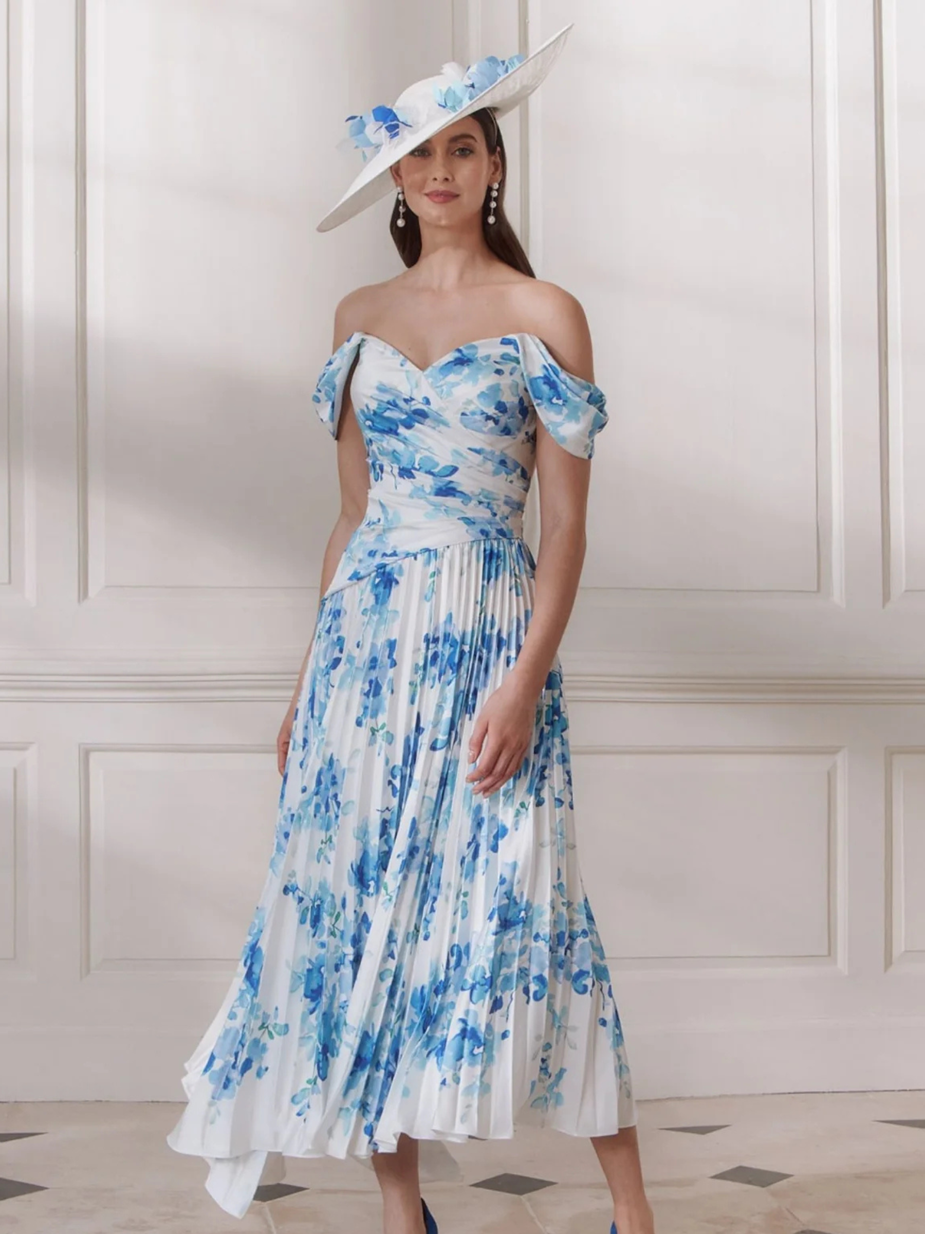 John Charles 66730A Pink Blossom Dress with off-the-shoulder draped sleeves, ruched bodice and a flowing pleated asymmetric midi skirt - a romantic floral occasion dress perfect for weddings and summer events.