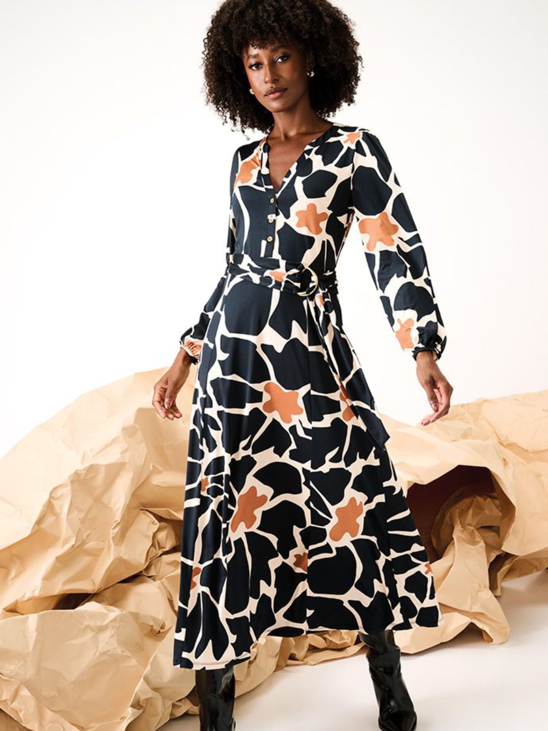 Women’s belted midi dress in burgundy and white abstract floral print with wrap waist, V-neckline and long sleeves for elegant autumn styling.